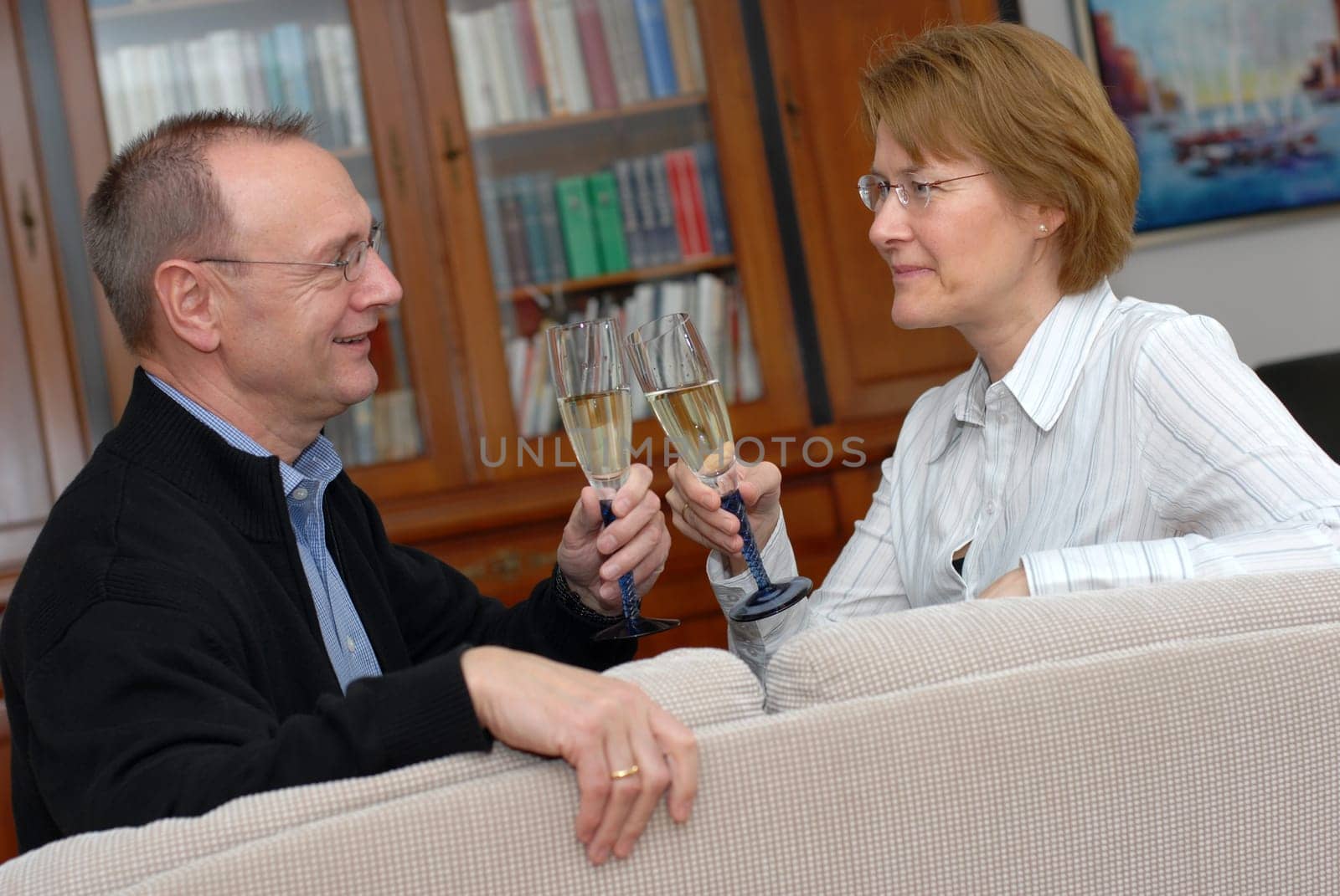 Middle-aged couple with champagne glasses