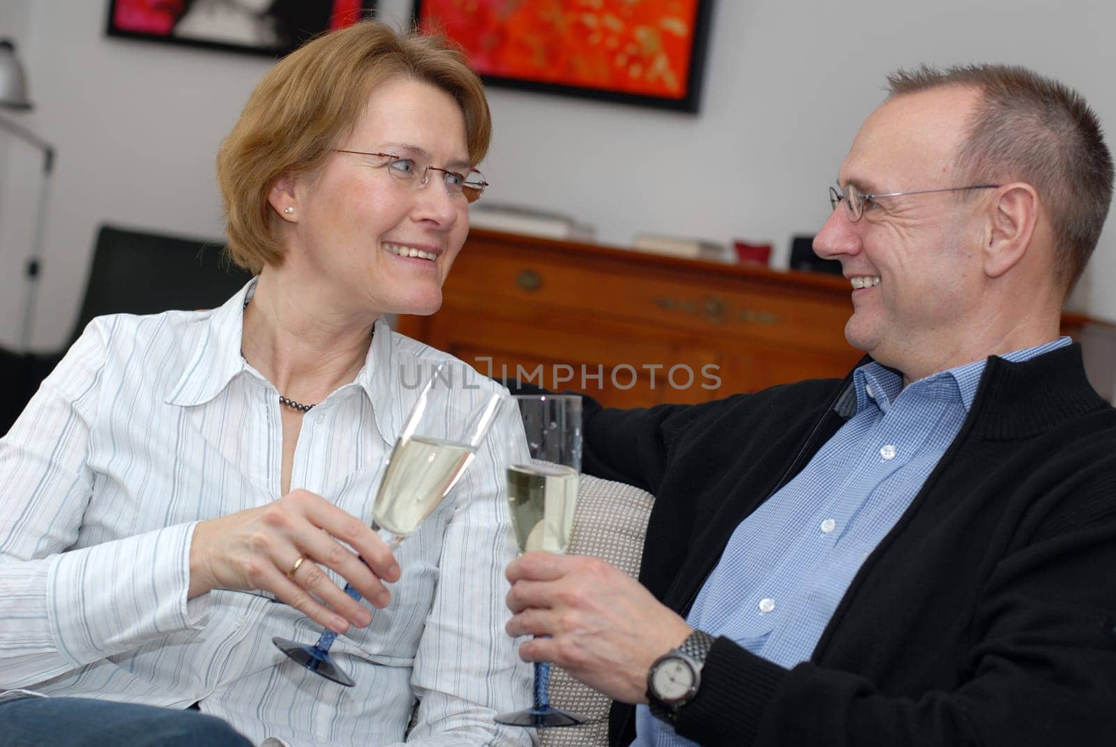 Middle-aged couple with champagne glasses