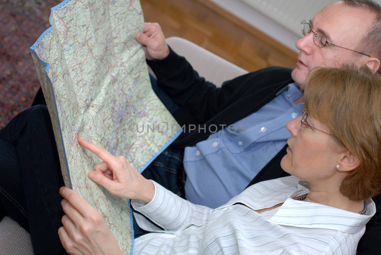 Middle-aged couple planning trip