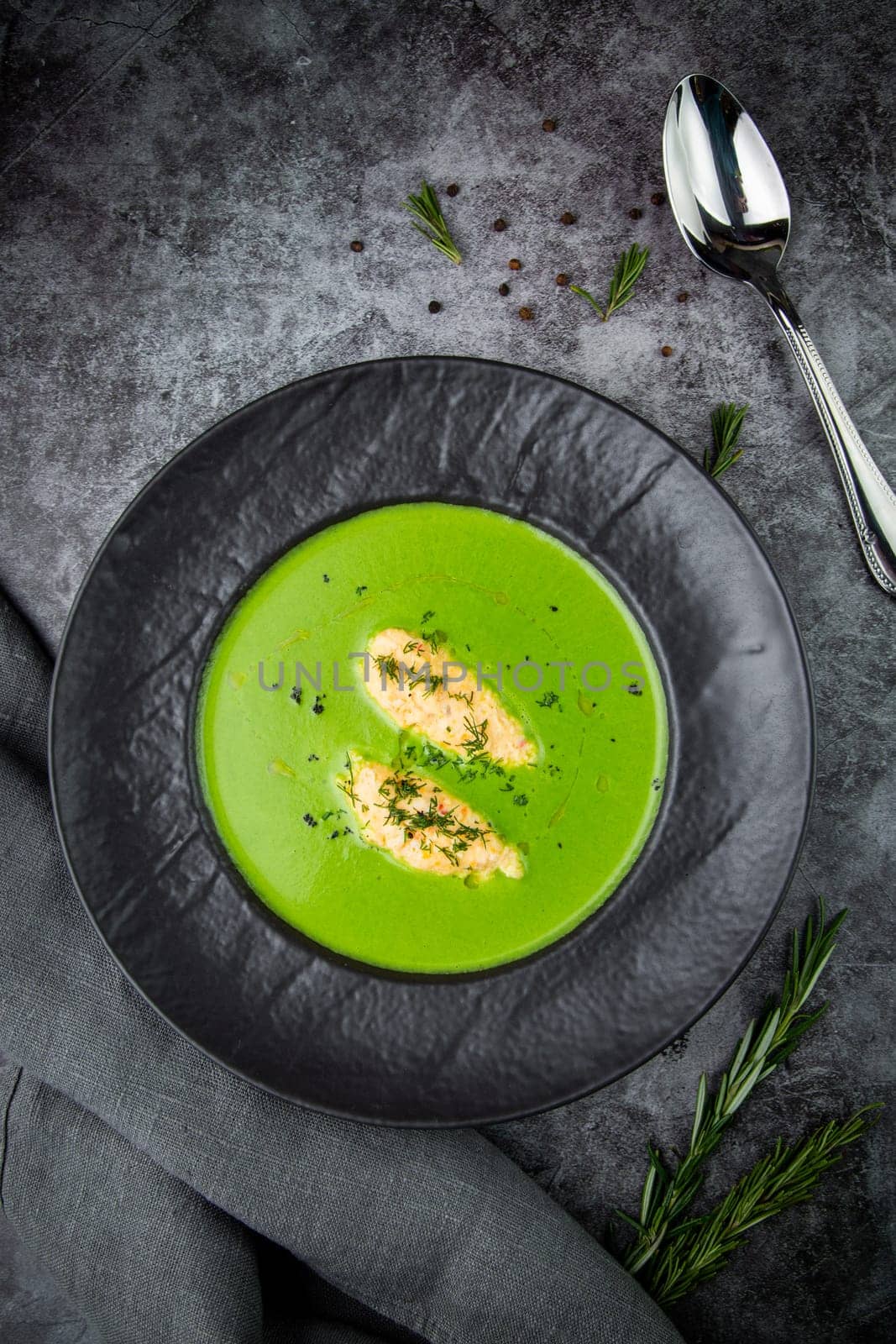 broccoli cream soup with pieces of chicken fillet