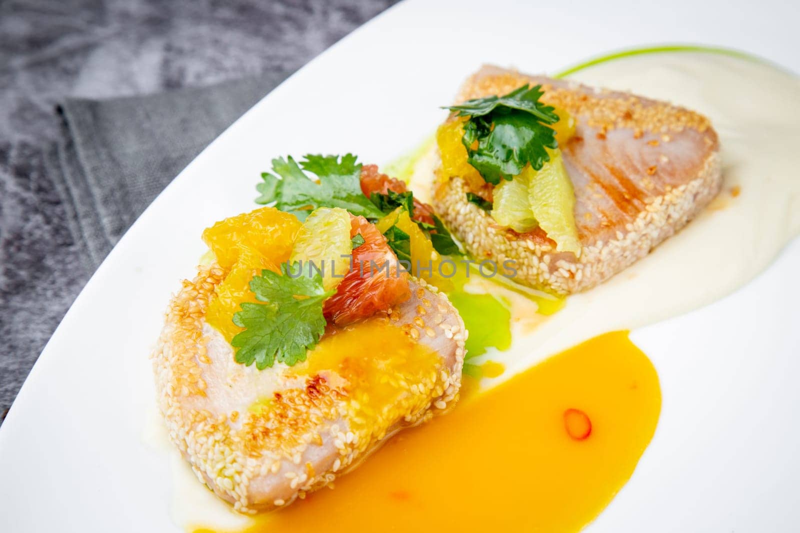 fish with tangerines, parsley and sesame breaded side view by tewolf