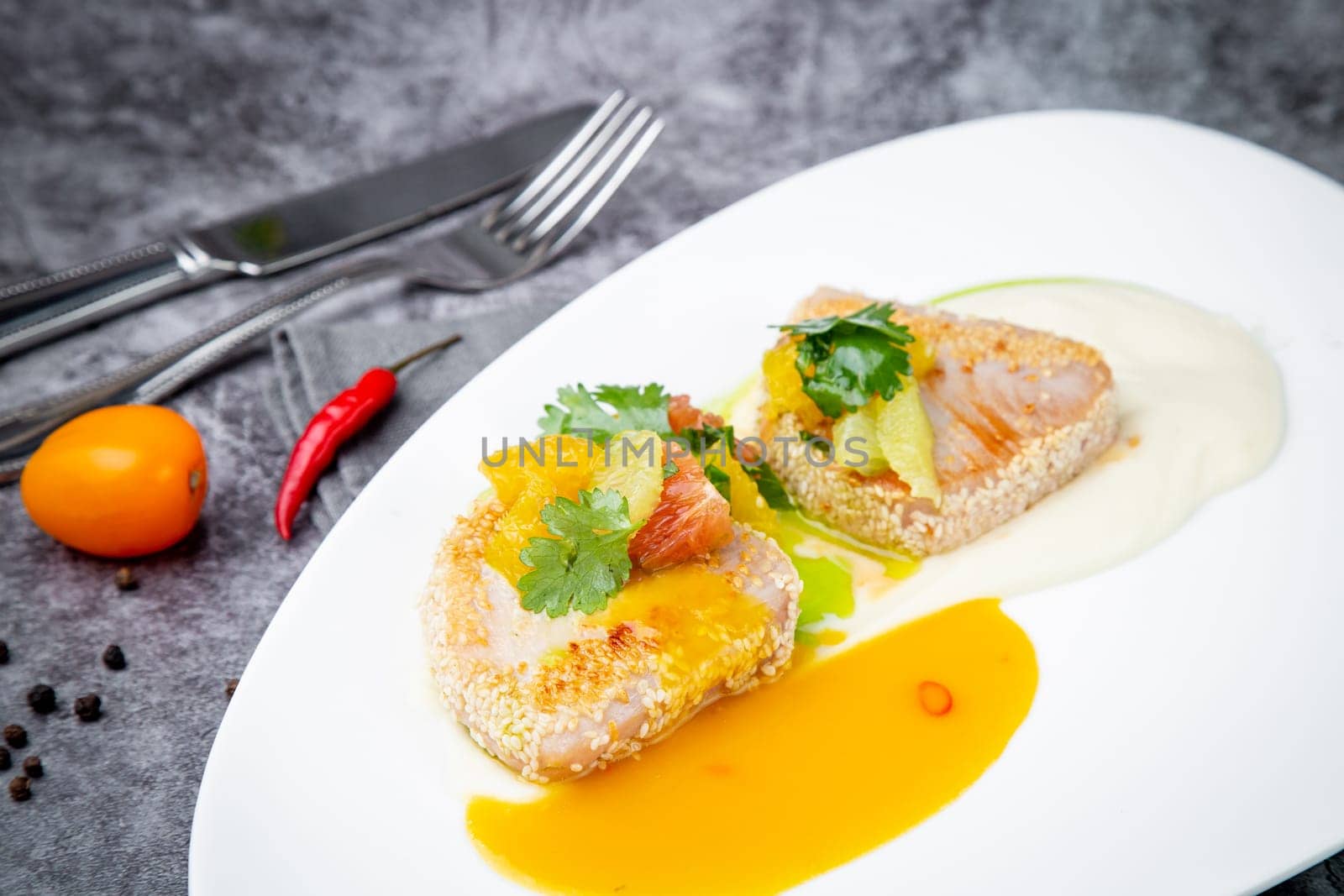 fish with tangerines, parsley and sesame breaded side view by tewolf