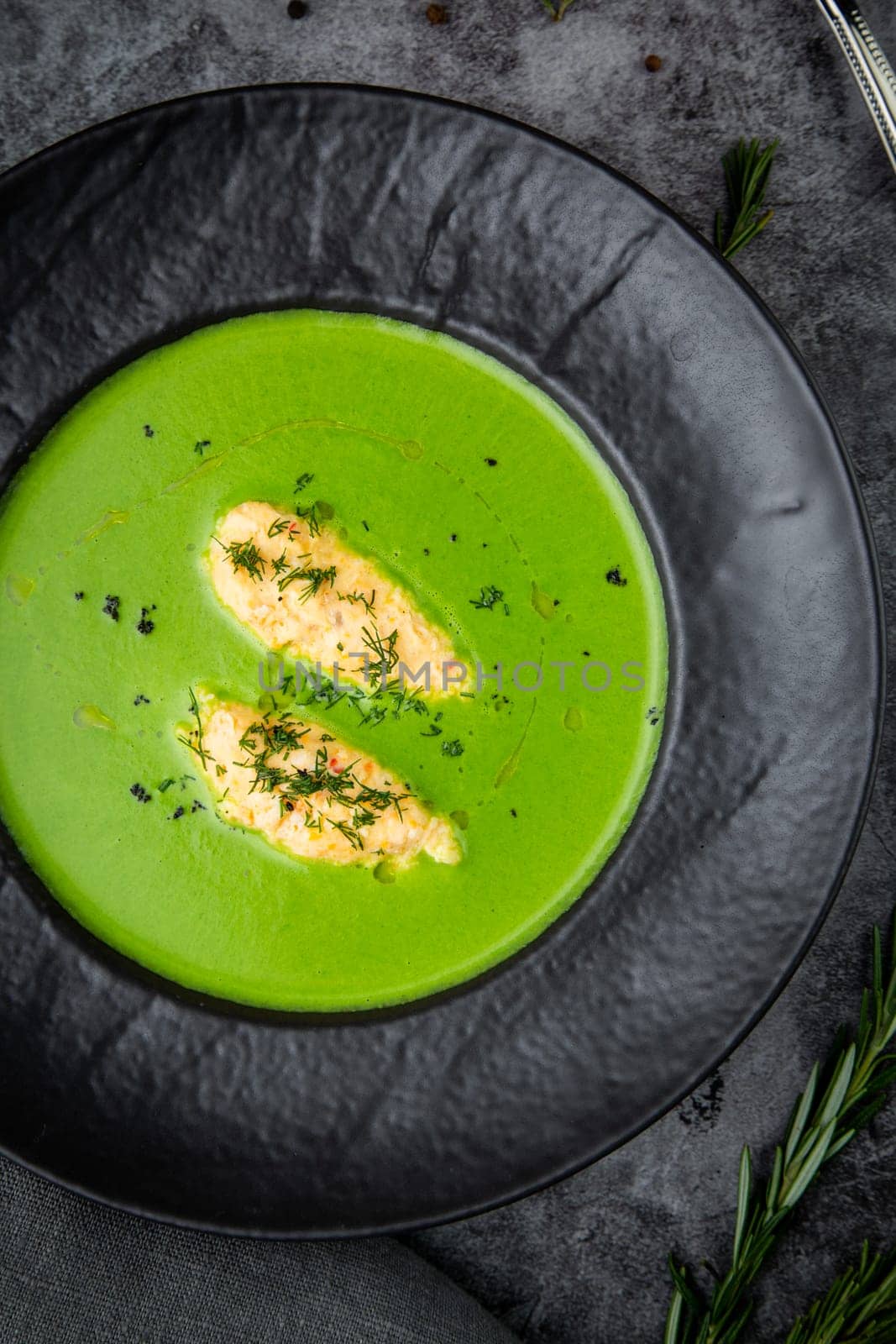 broccoli cream soup with pieces of chicken fillet