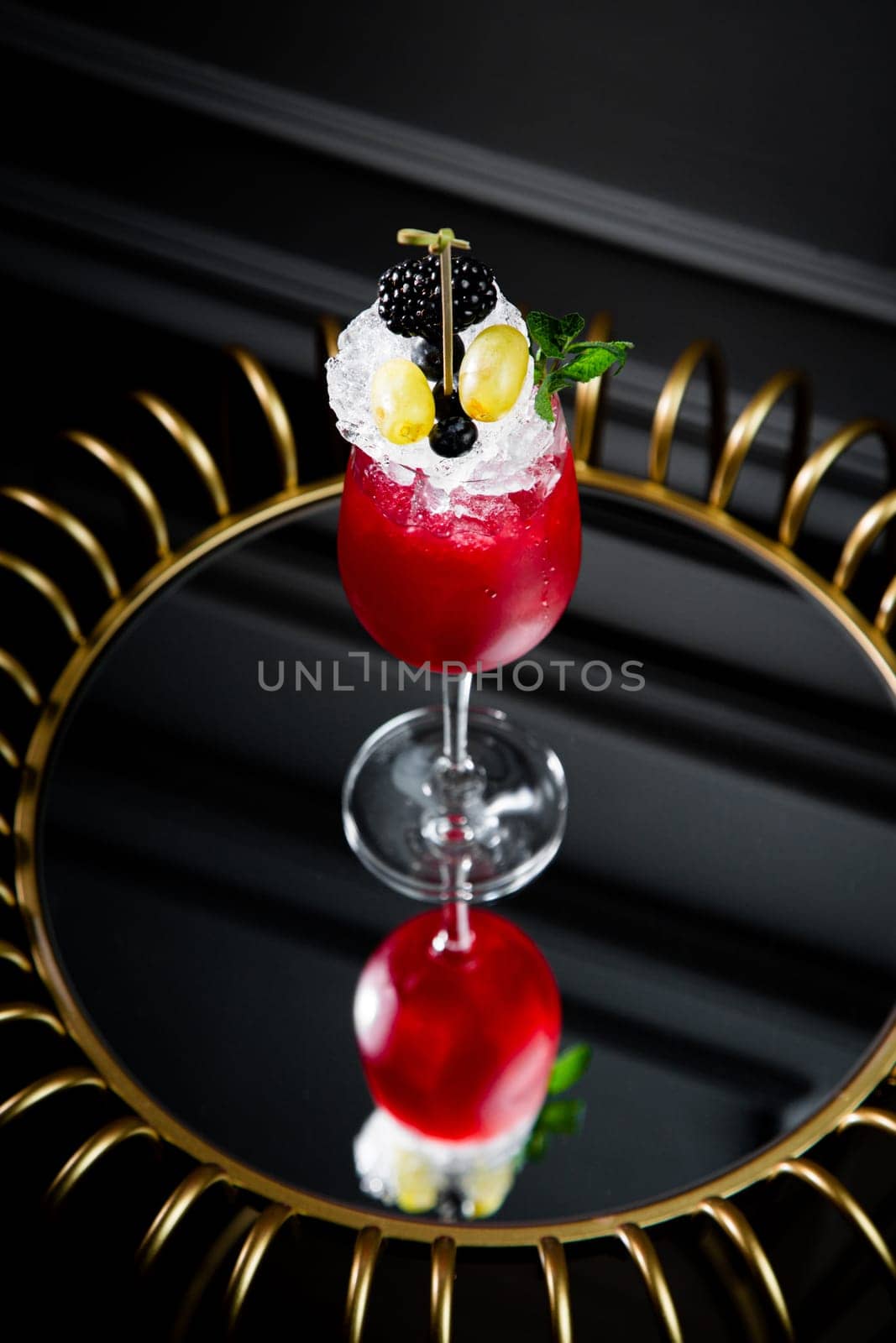 red cocktail on a dark background