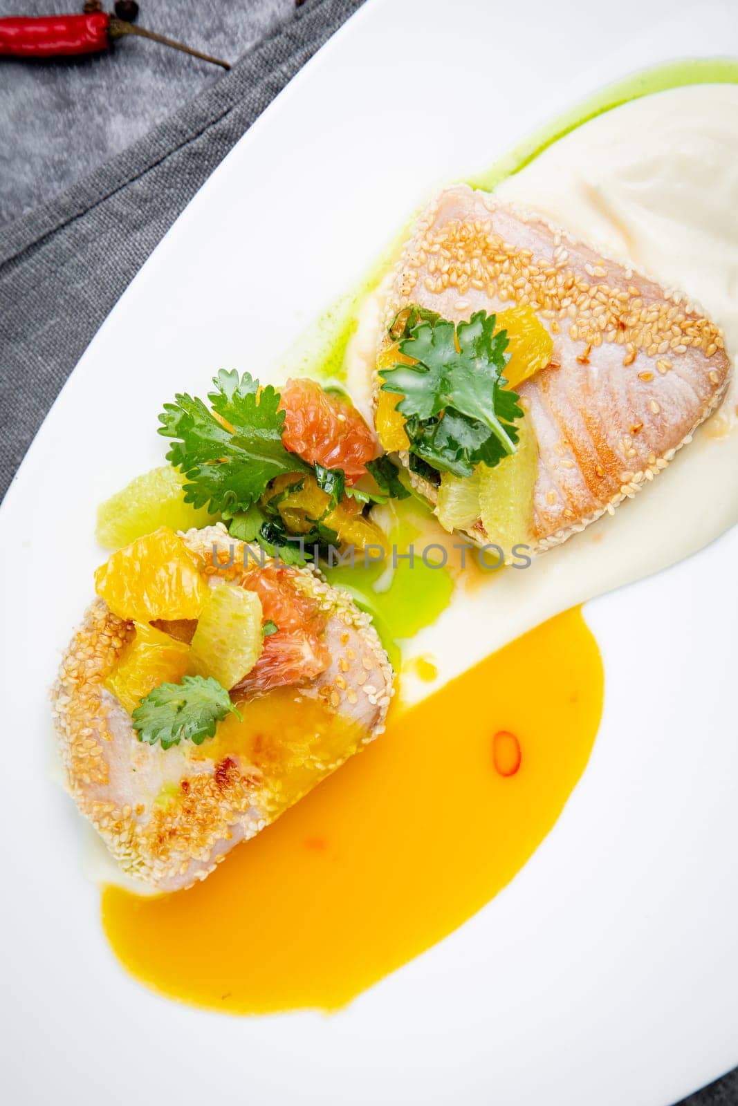 fish with tangerines, parsley and sesame breaded