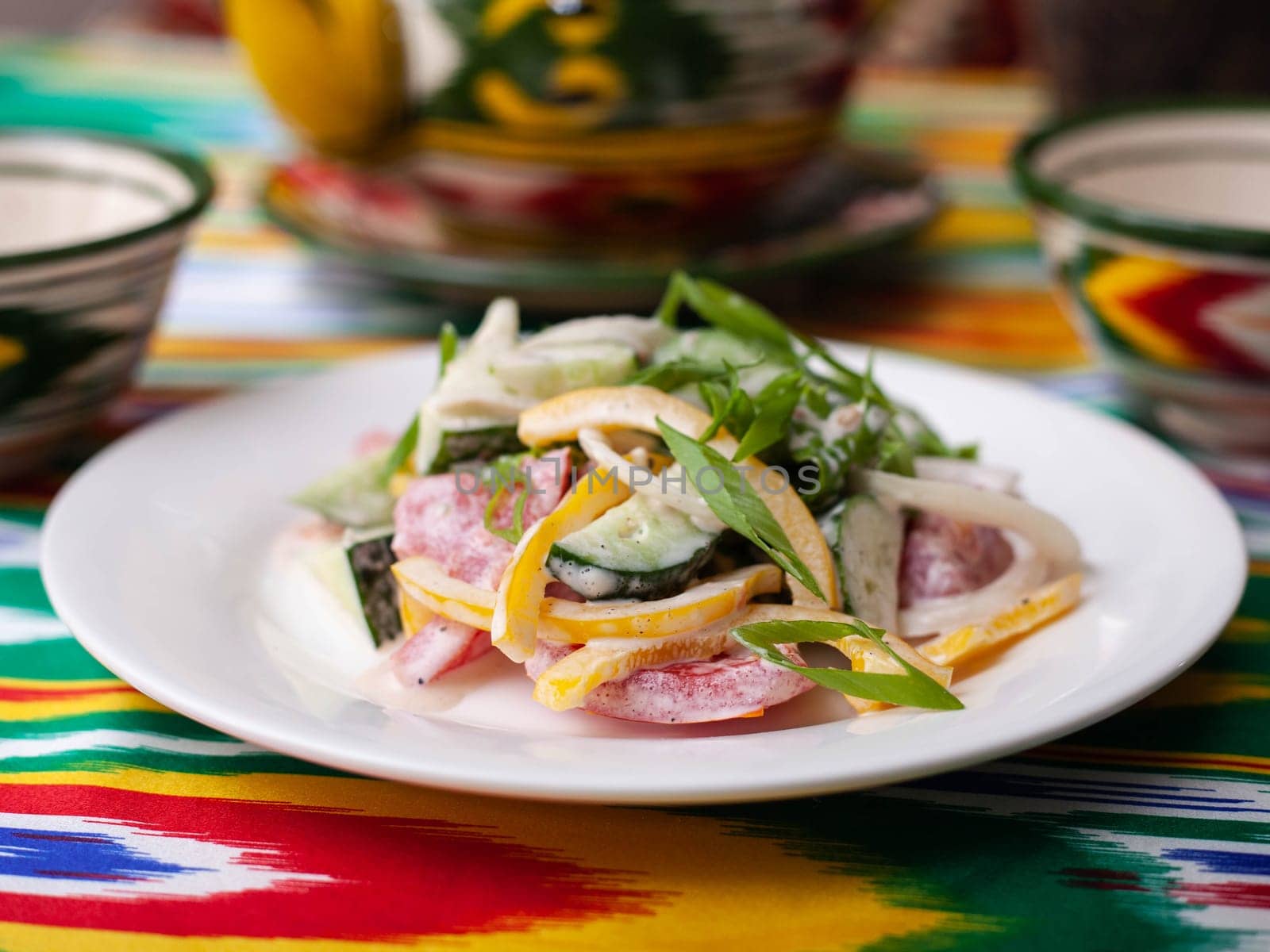 Creamy salad of green and red peppers, cheese, eggplant, onions and tomatoes Asian style. High quality photo