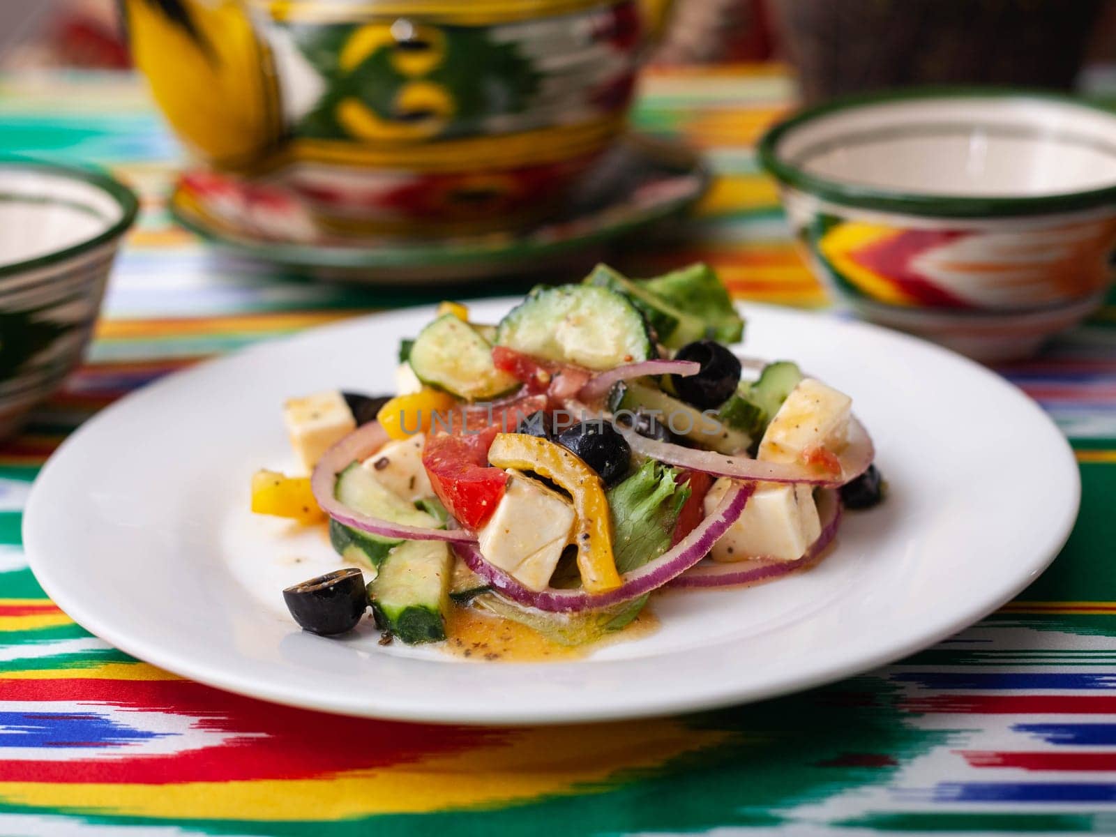 warm salad of green and red peppers, cheese, eggplants, onions and tomatoes Asian style. High quality photo