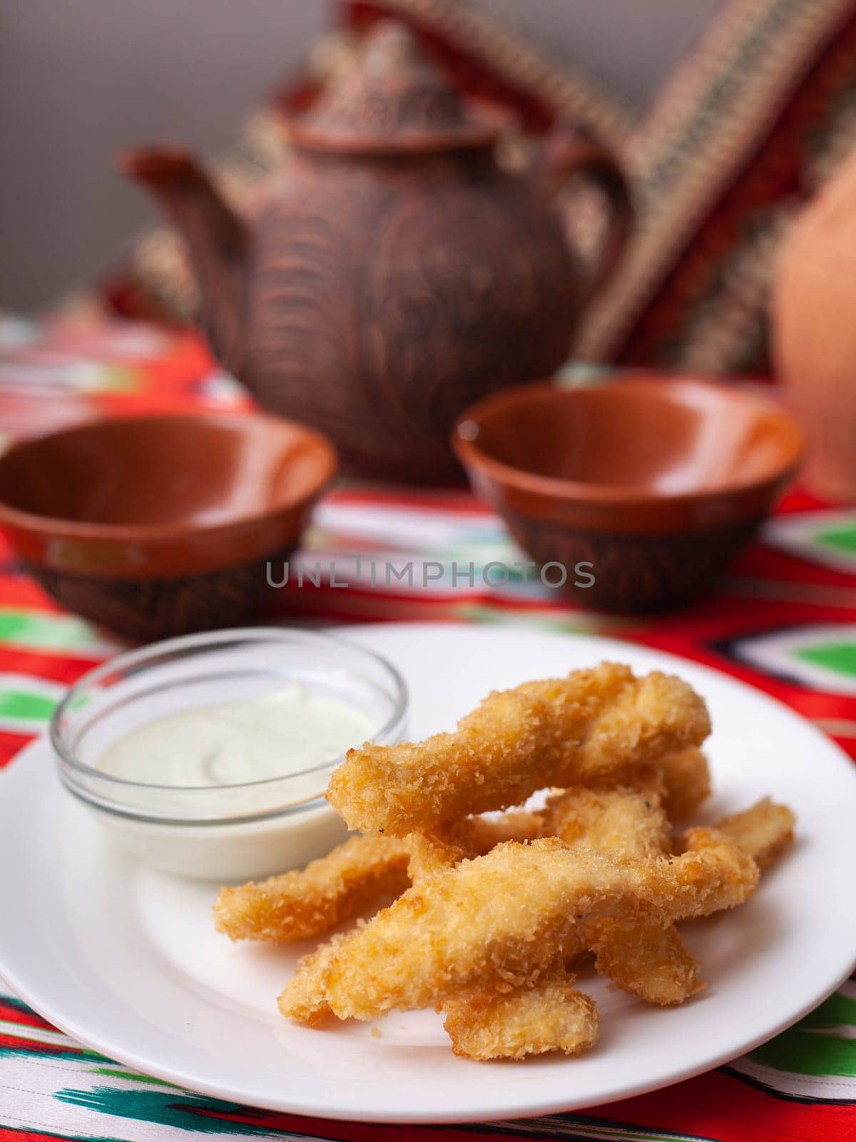chicken nuggets - and breaded fried chicken served with a creamy sauce. Asian style. High quality photo