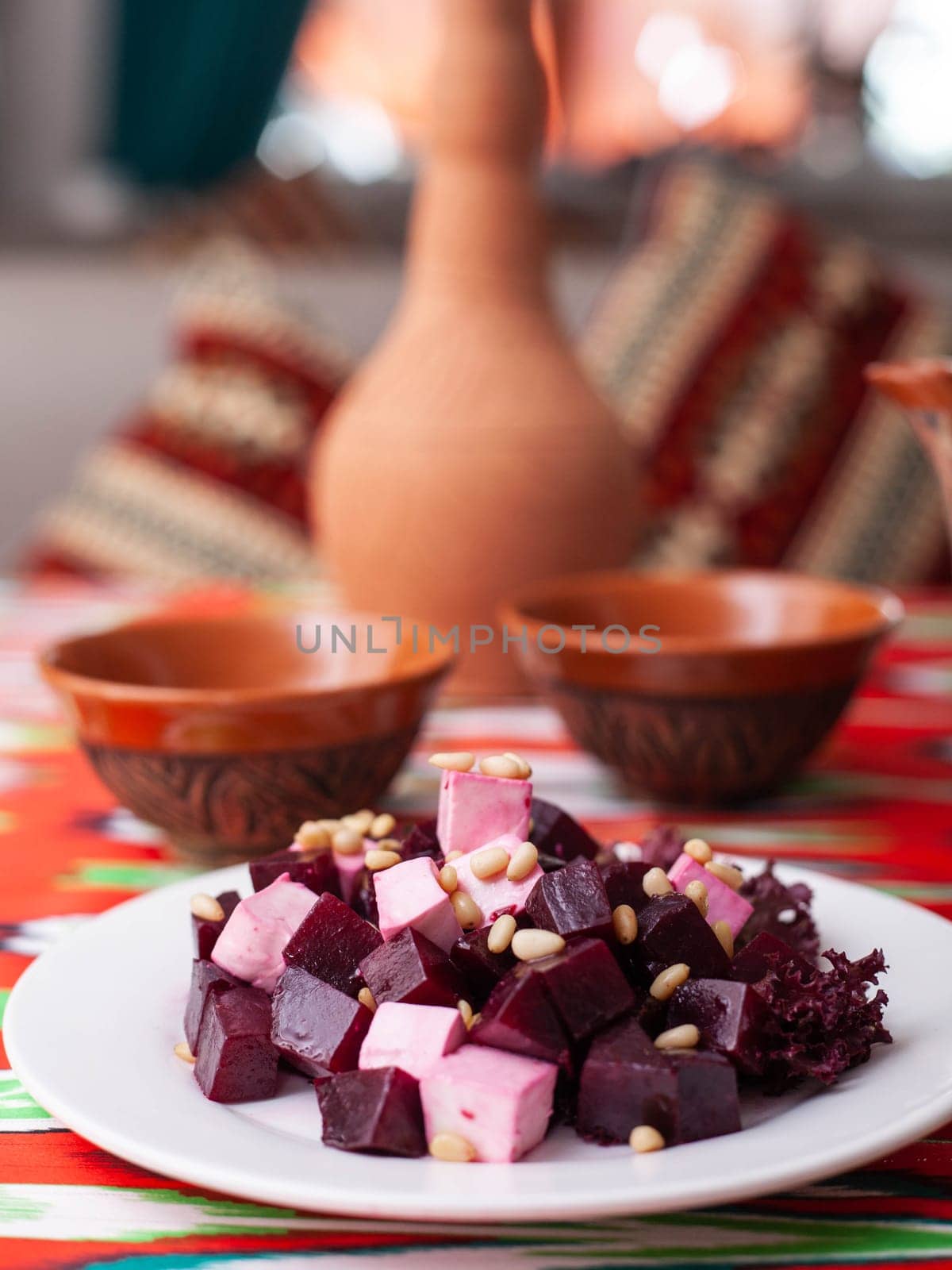 Beetroot and cheese salad with pine nuts dressed with butter. Asian style. High quality photo