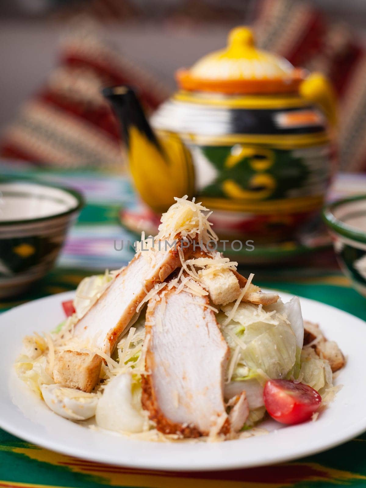 Caesar salad with chicken breast, herbs and cheese. Asian style. High quality photo