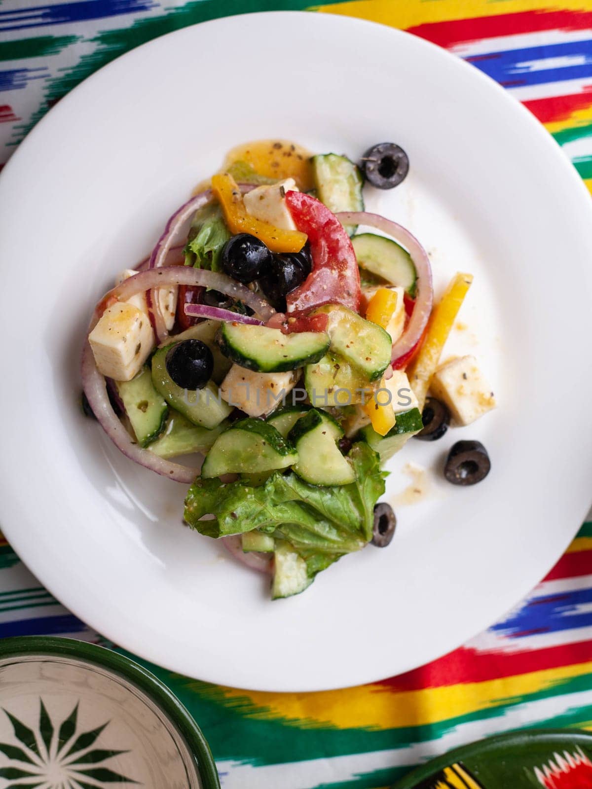 warm salad of green and red peppers, cheese, eggplants, onions and tomatoes Asian style. High quality photo