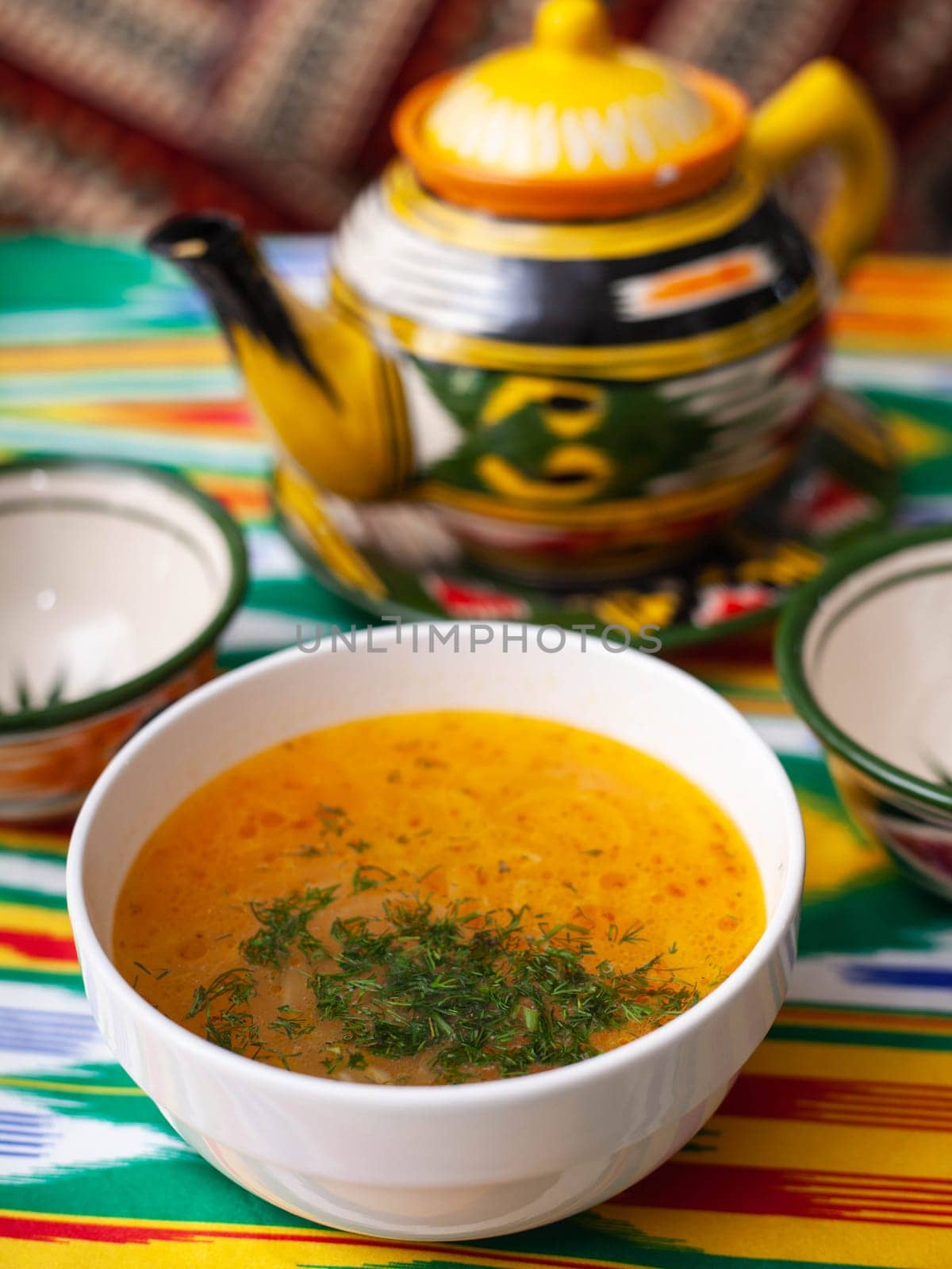 Red tomato soup with herbs, potatoes and meat. Eastern cuisine by tewolf