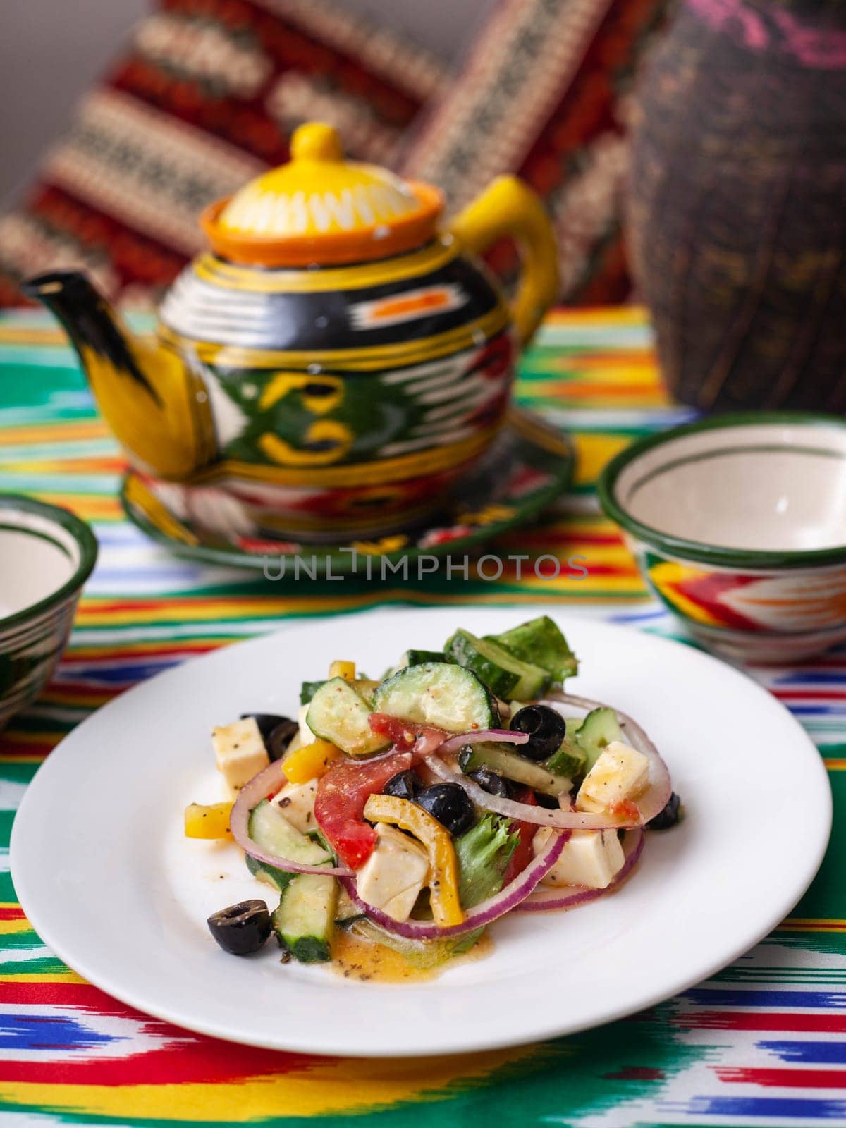 warm salad of green and red peppers, cheese, eggplants, onions and tomatoes Asian style. High quality photo