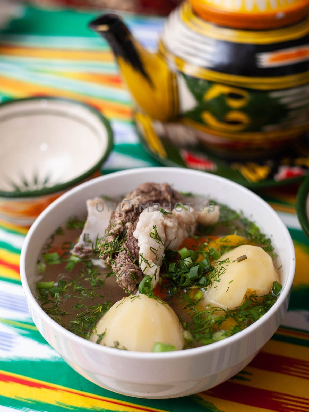 Surpa Soup from Boiled beef, potatoes and onions according to an oriental recipe. Eastern cuisine, national dish. High quality photo