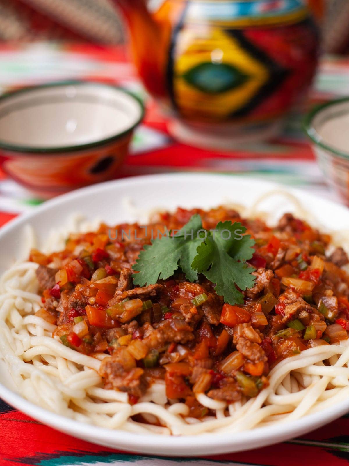 The oriental dish guiru lagman is homemade noodles fried with meat, vegetables and herbs. Eastern cuisine by tewolf