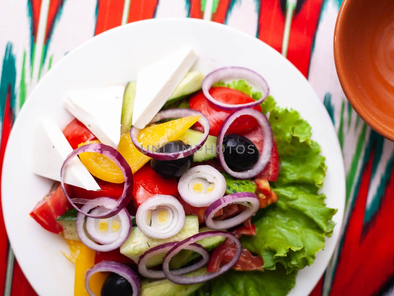 Vegetable slicing in Georgian style - tomatoes, cucumbers, greens, Bulgarian pepper, cheese, onion. Asian style by tewolf