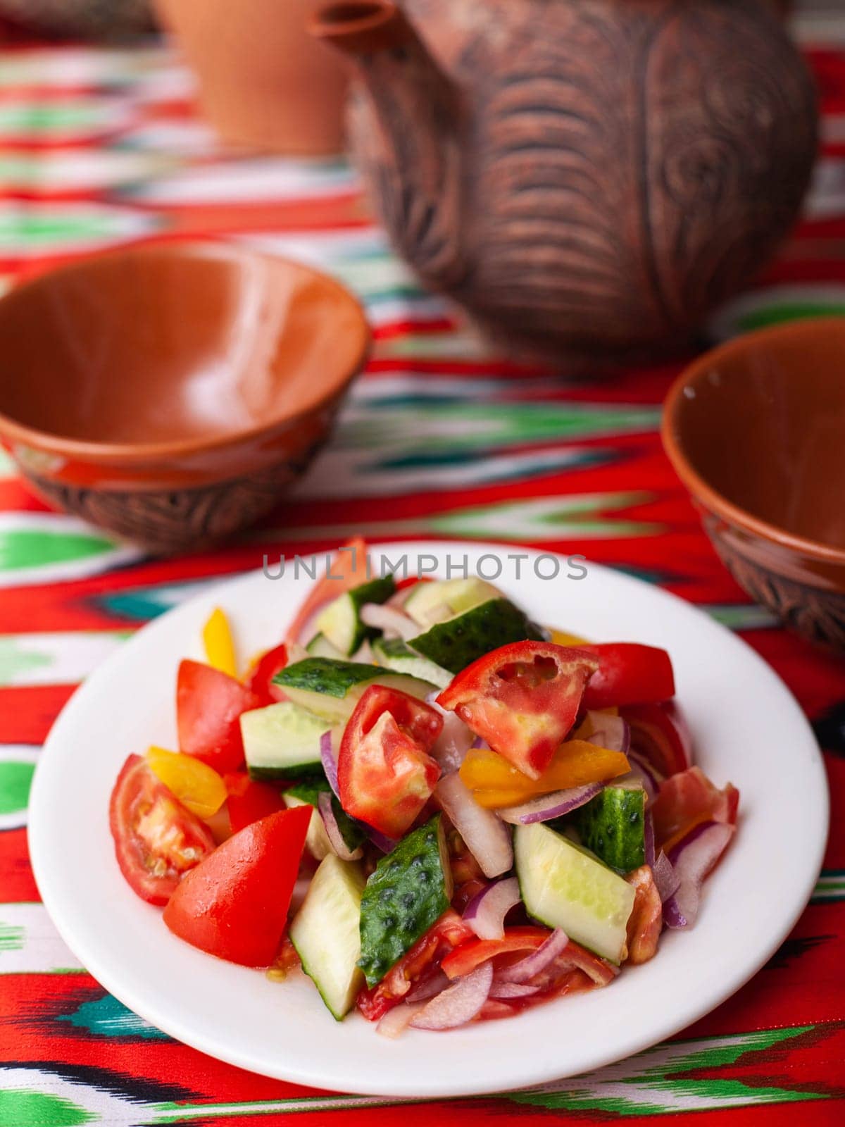 Tomato, cucumber, sweet pepper and onion salad, seasoned with oil. Asian style by tewolf