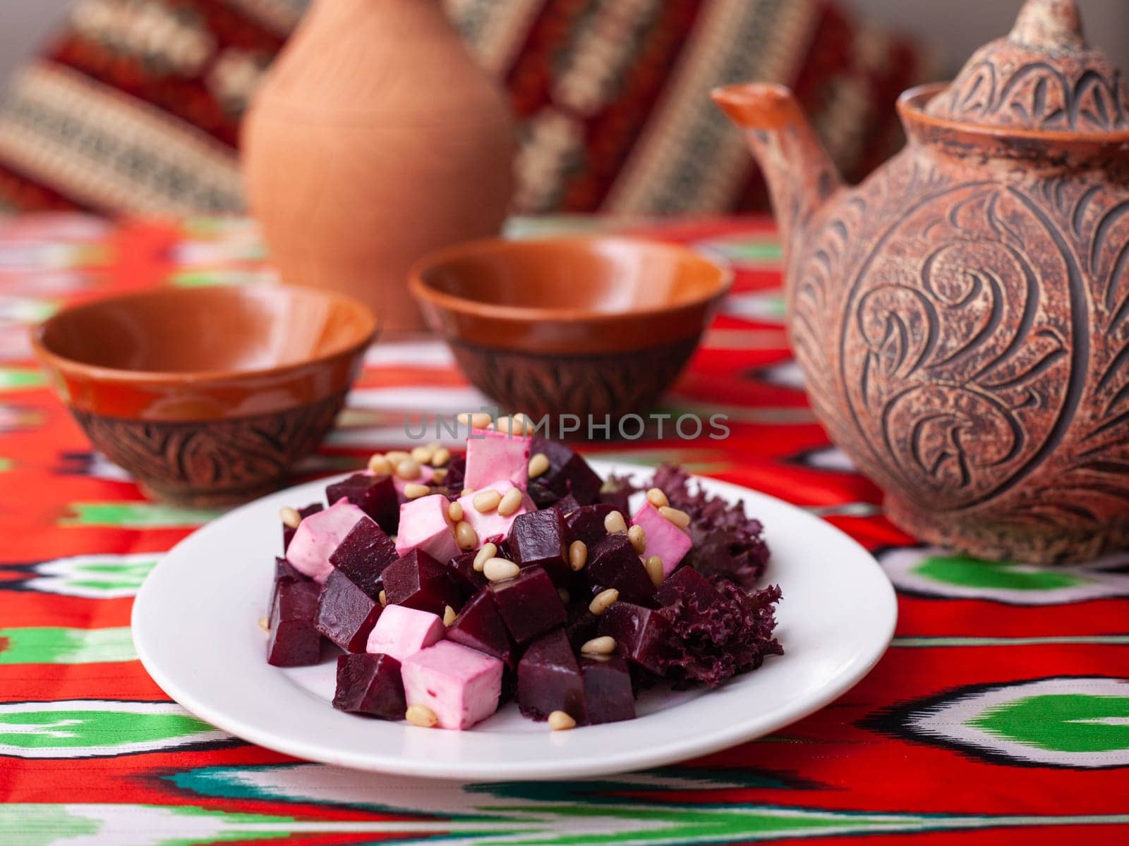 Beetroot and cheese salad with pine nuts dressed with butter. Asian style by tewolf