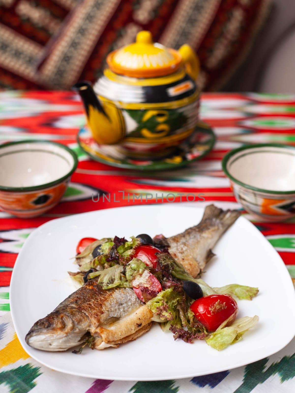 Fried fish with a pillow of stewed vegetables. Asian style by tewolf