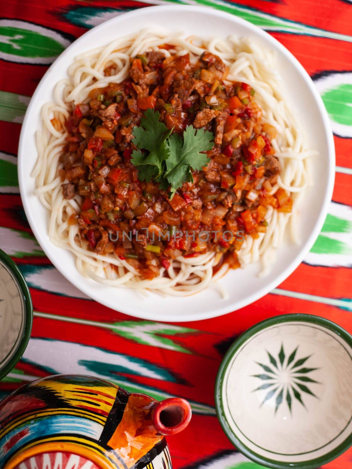 The oriental dish guiru lagman is homemade noodles fried with meat, vegetables and herbs. Eastern cuisine by tewolf