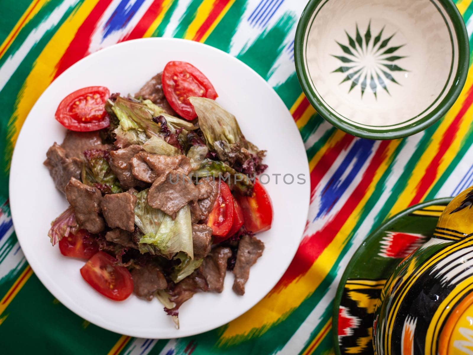 Uyghur fried meat with pepper and vegetables. Asian style. High quality photo