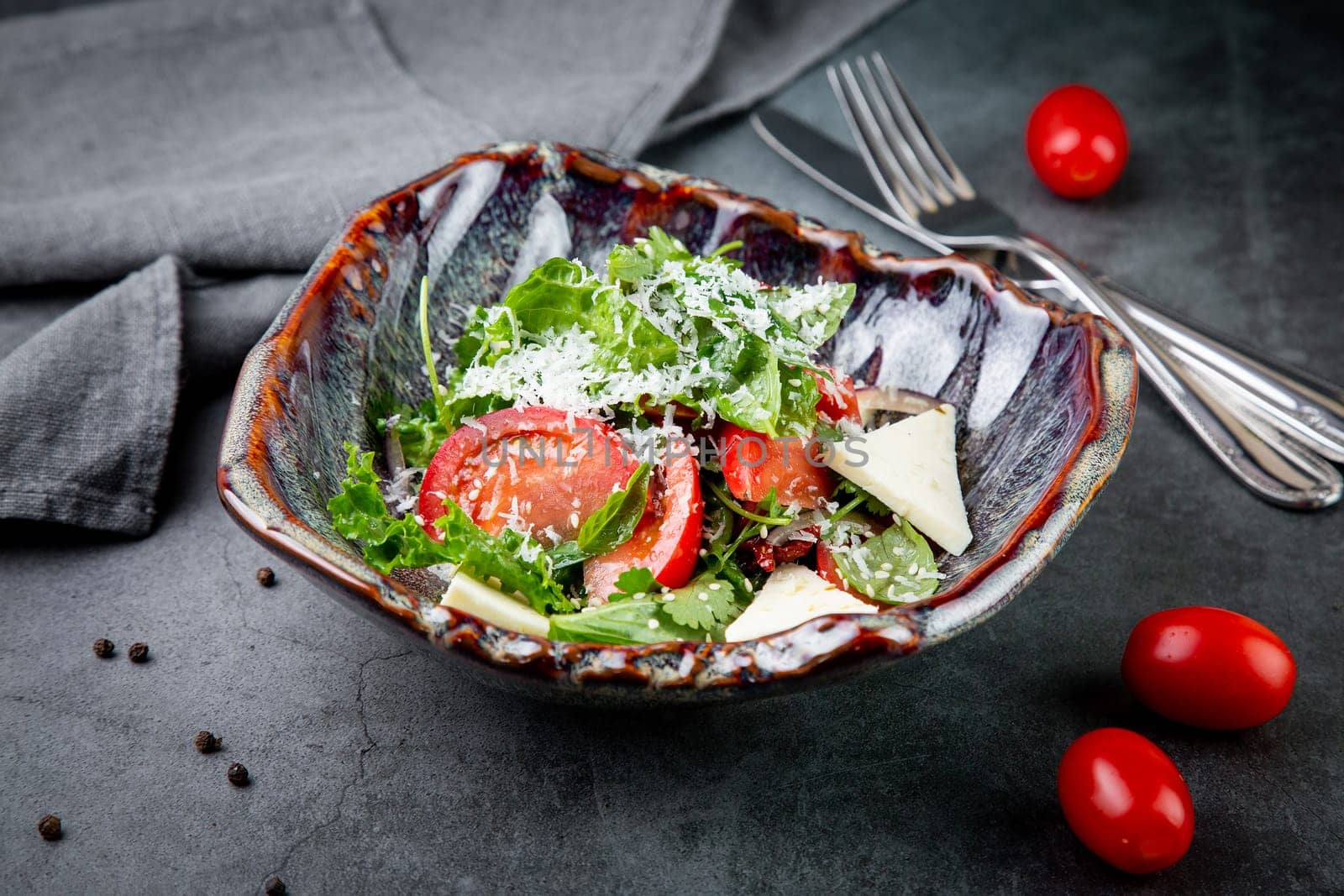 salad with tomatoes, feta cheese, lettuce and parsley