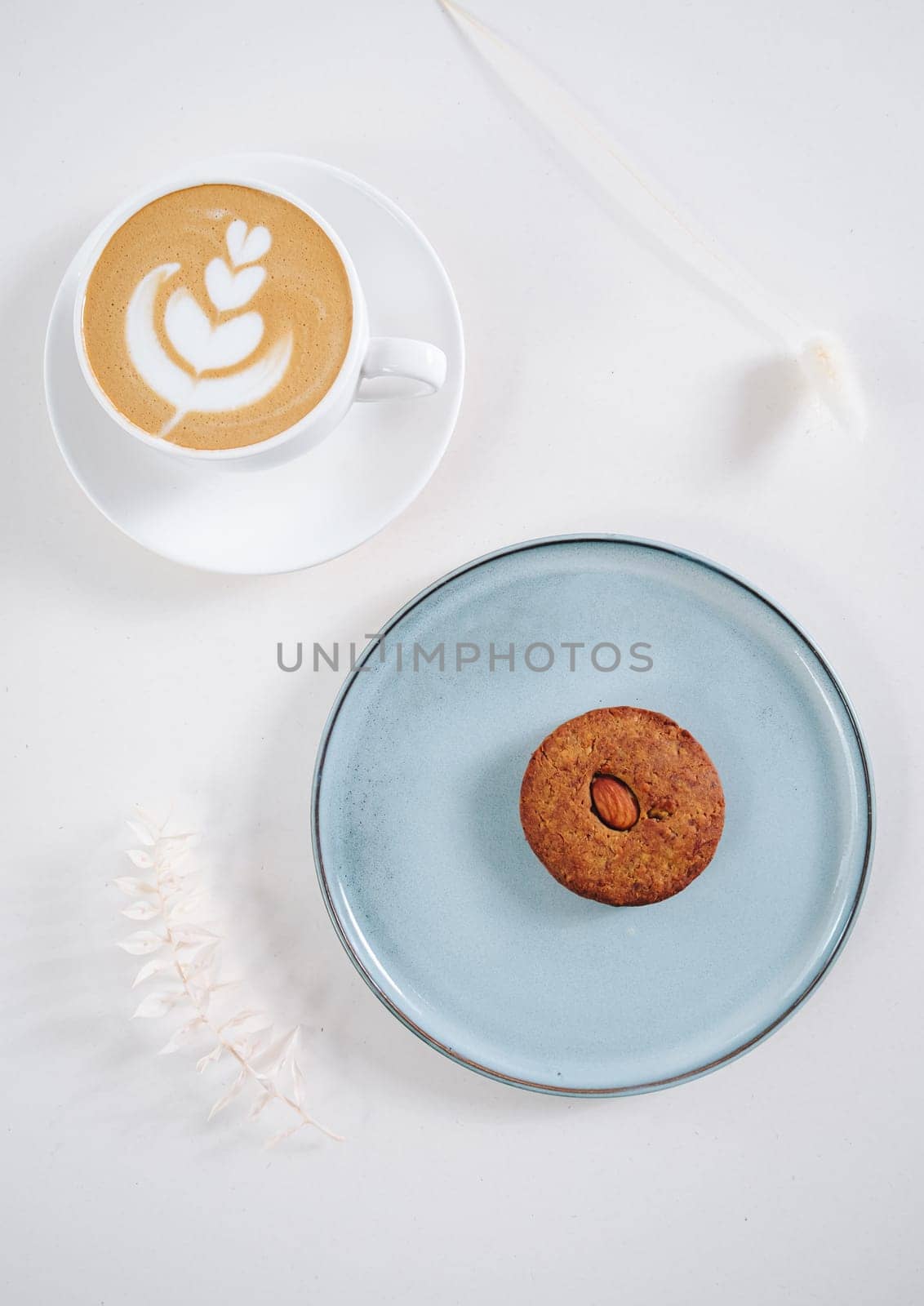 Cookies with nuts inside and coffee with a pattern