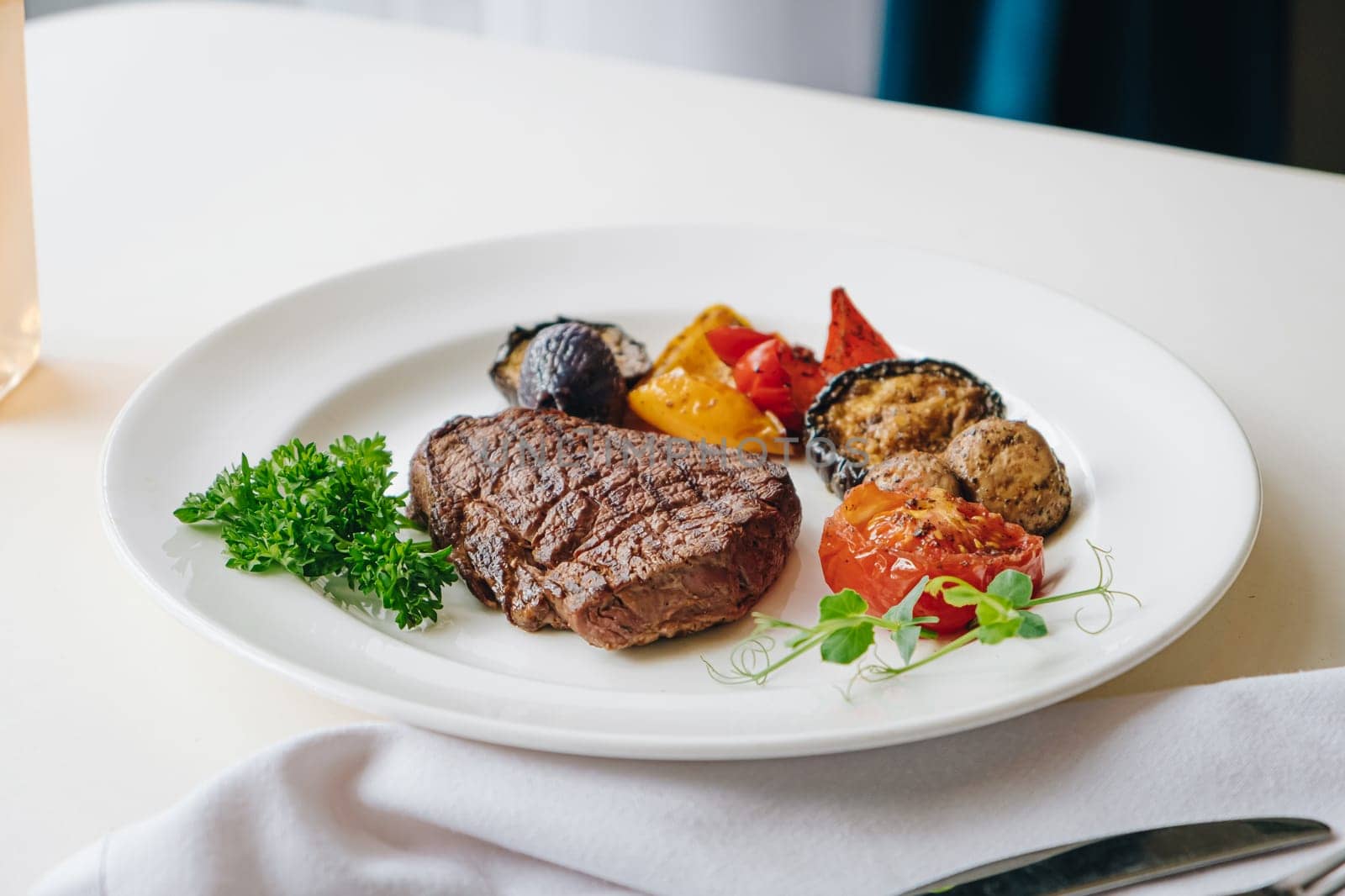 beef steak with grilled vegetables and herbs