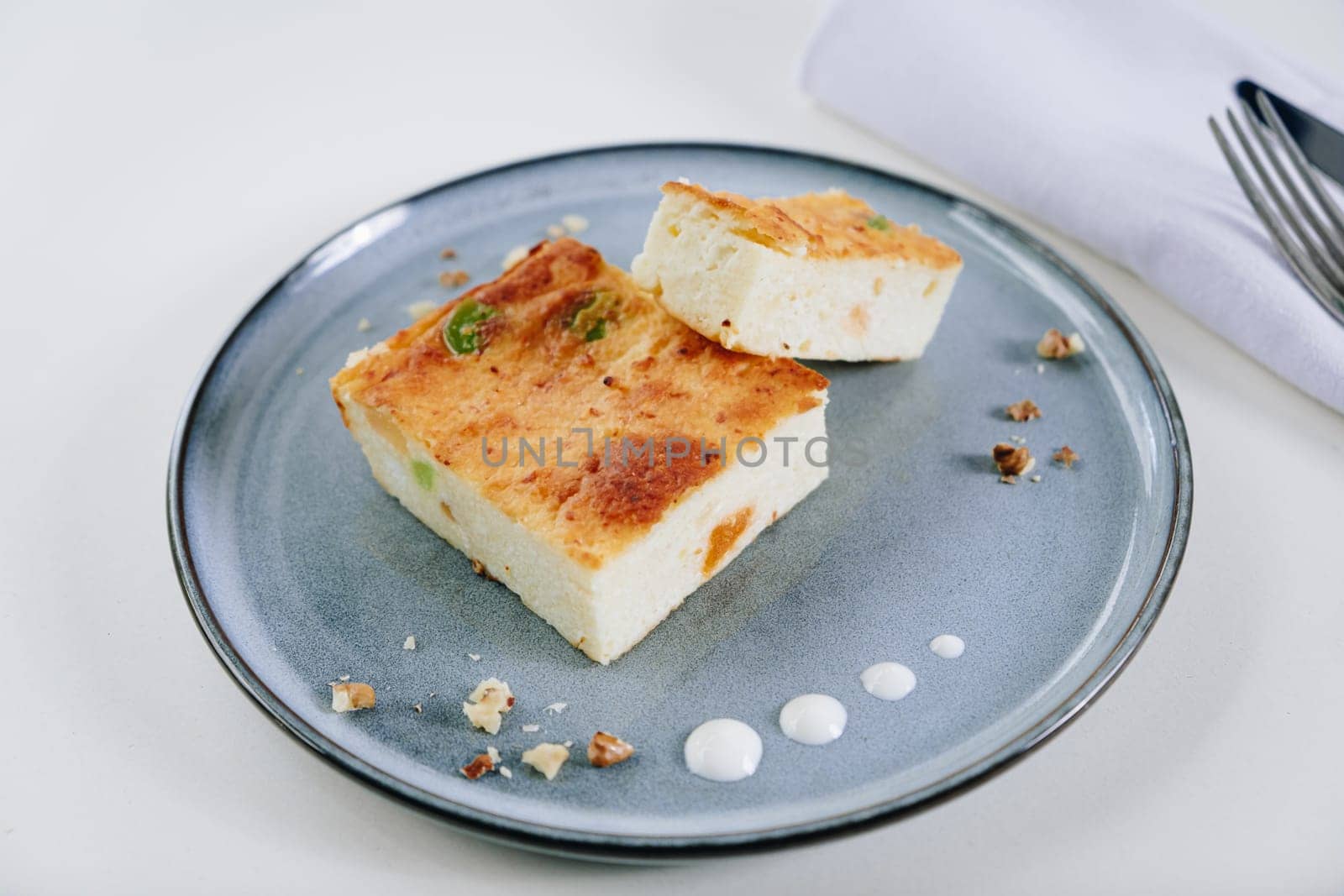 delicate dessert cottage cheese casserole on a light background by tewolf