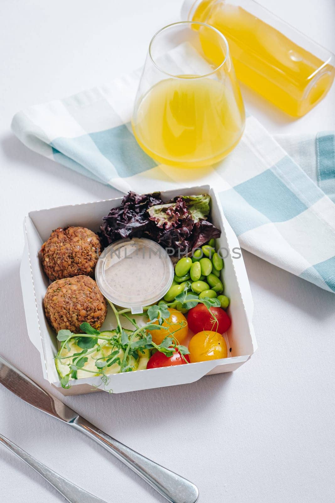meatballs with beans, herbs, cherry tomatoes and sauce