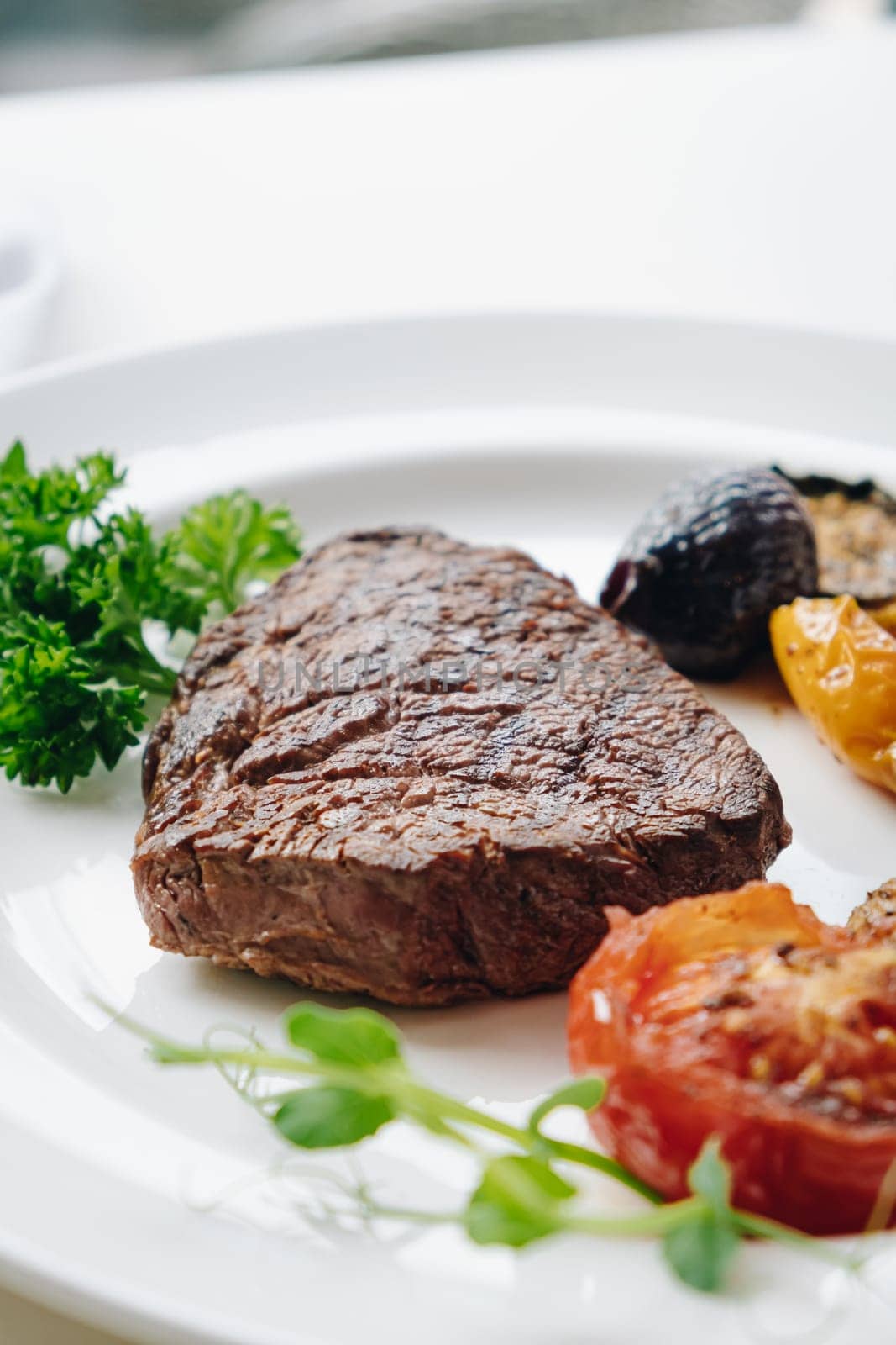 beef steak with grilled vegetables and herbs