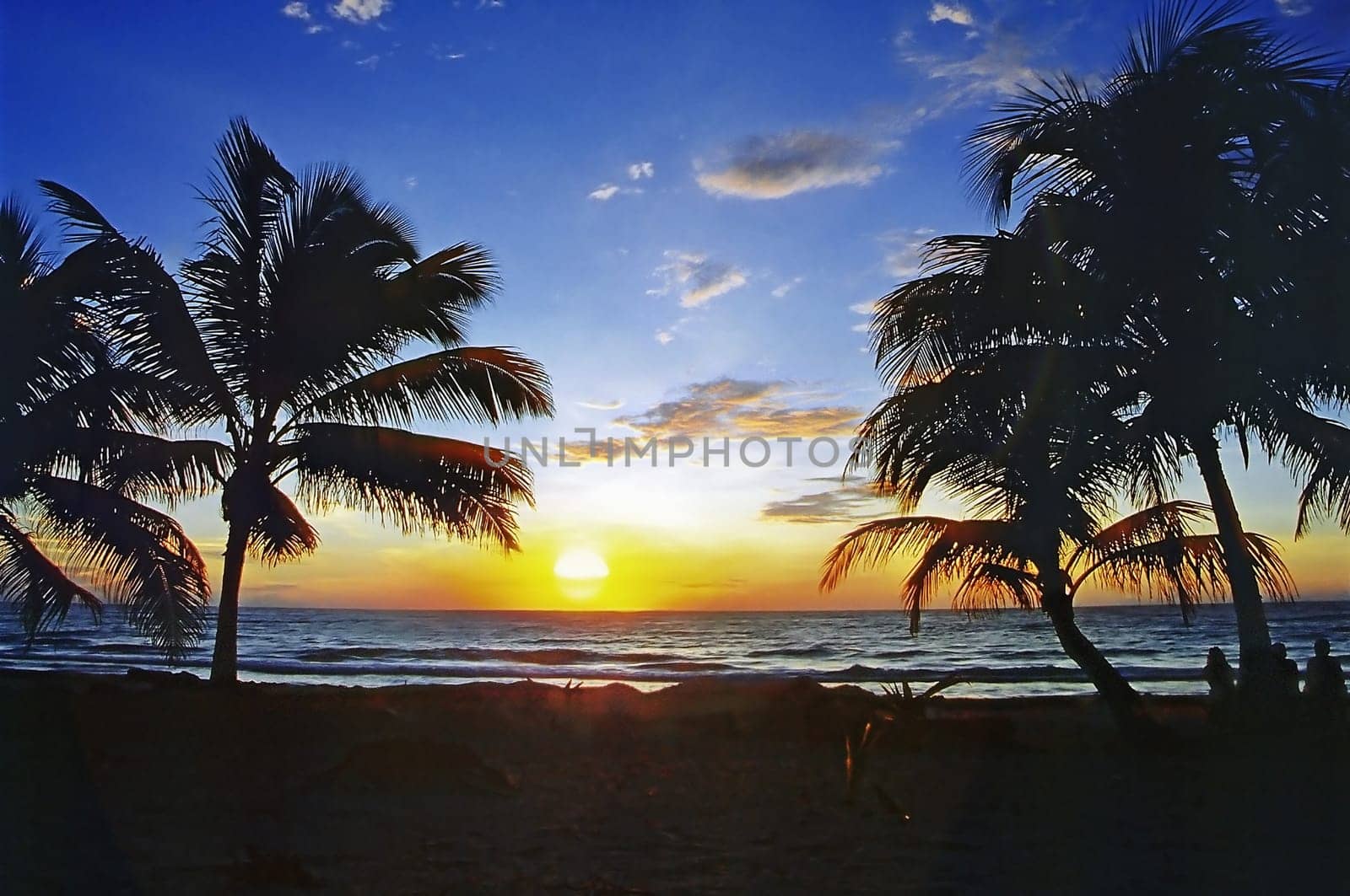 The picture was taken in 1990 and shows the beach Punta Allen near Tulum / Mexico. We got up very early to be able to experience this sunrise.