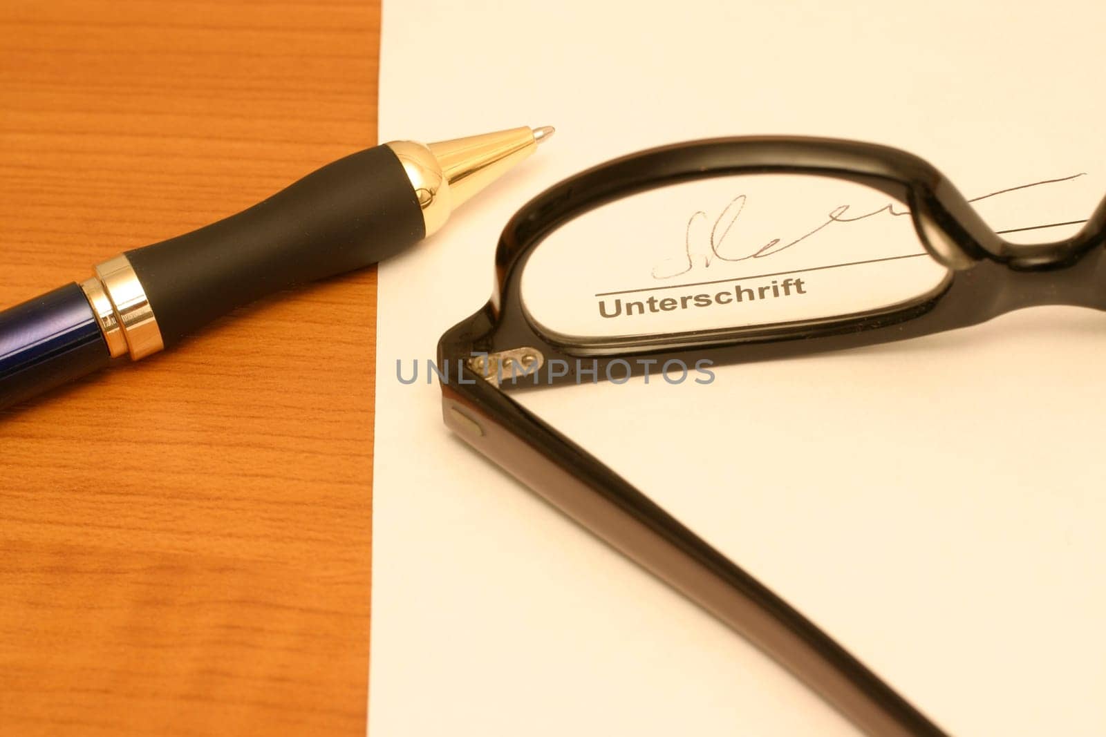 Glasses,pen with lettering signature