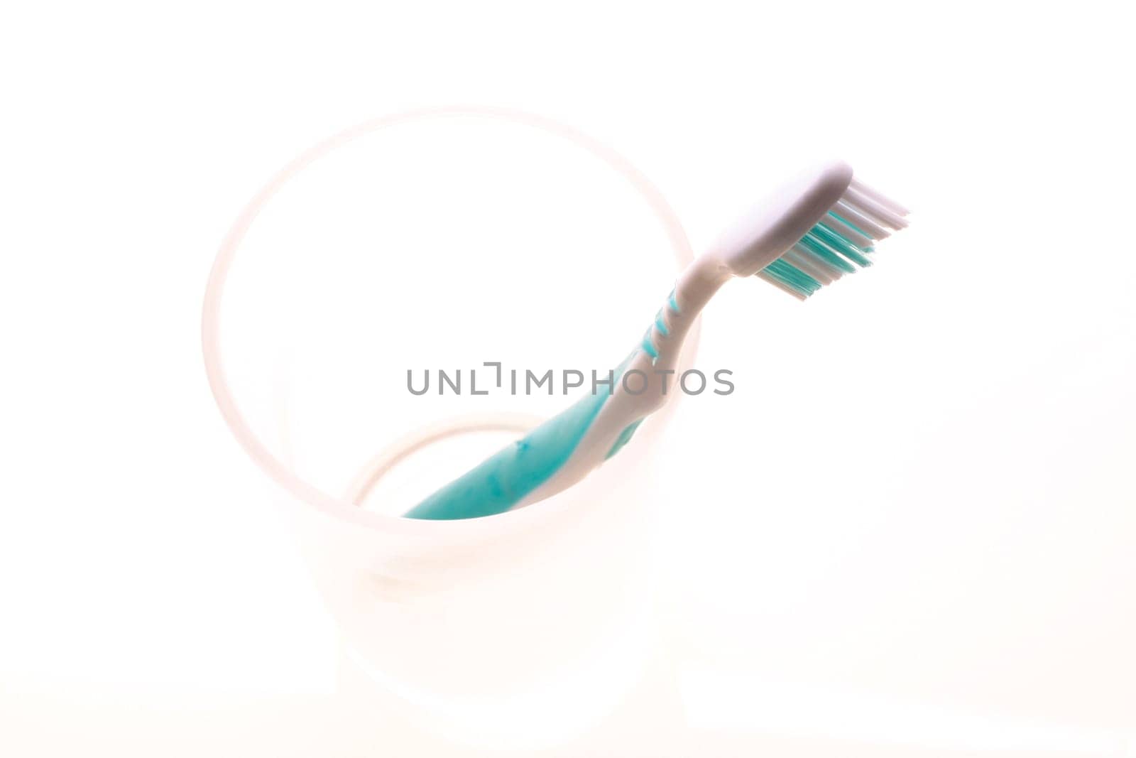 Toothbrush with cup