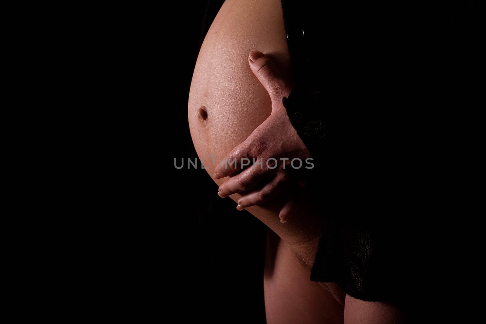 Holding baby bump