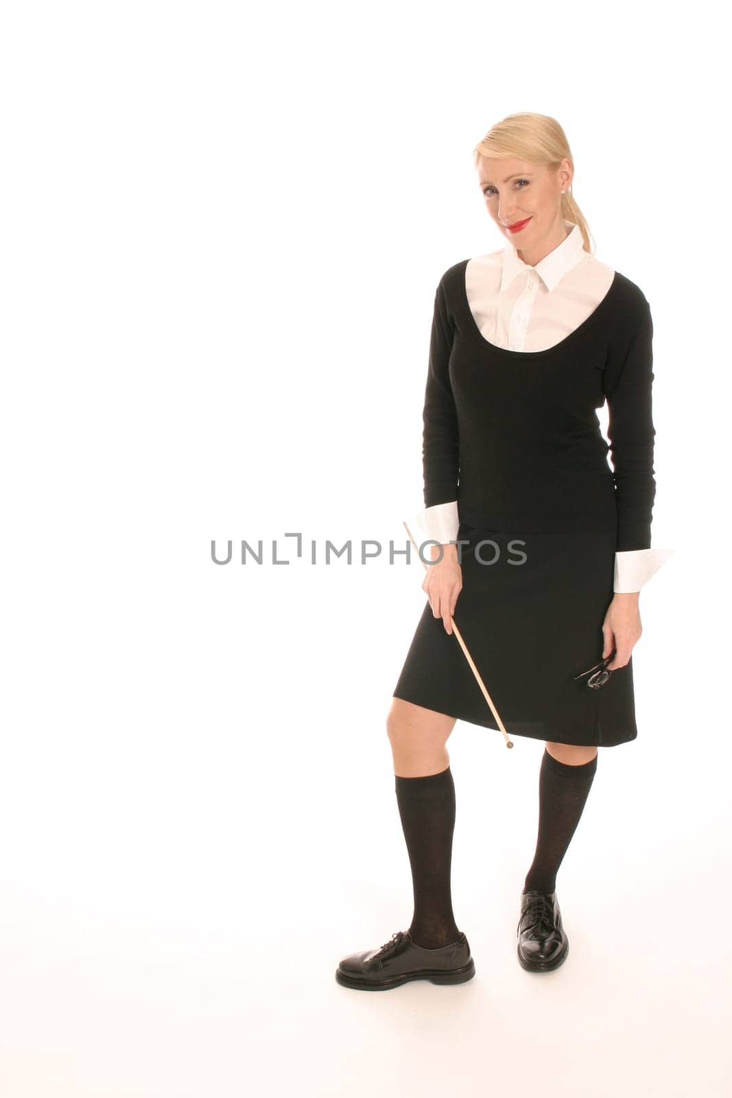 Young blonde woman with pointing stick