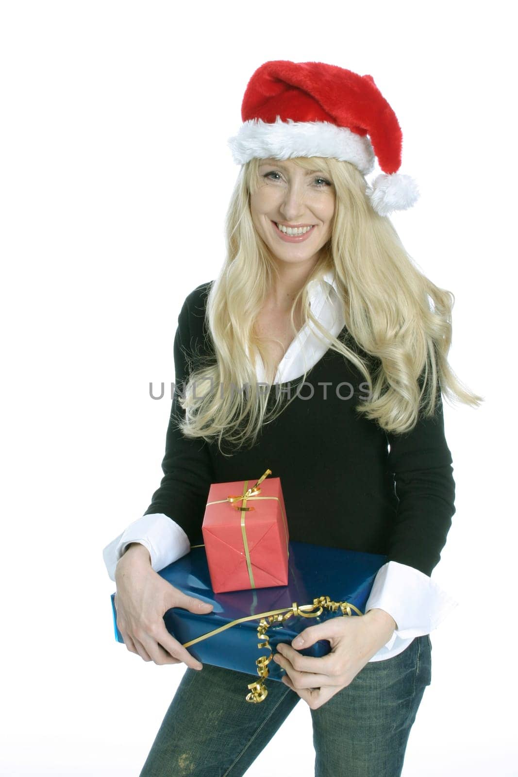 Young woman with Santa Claus hat and gifts