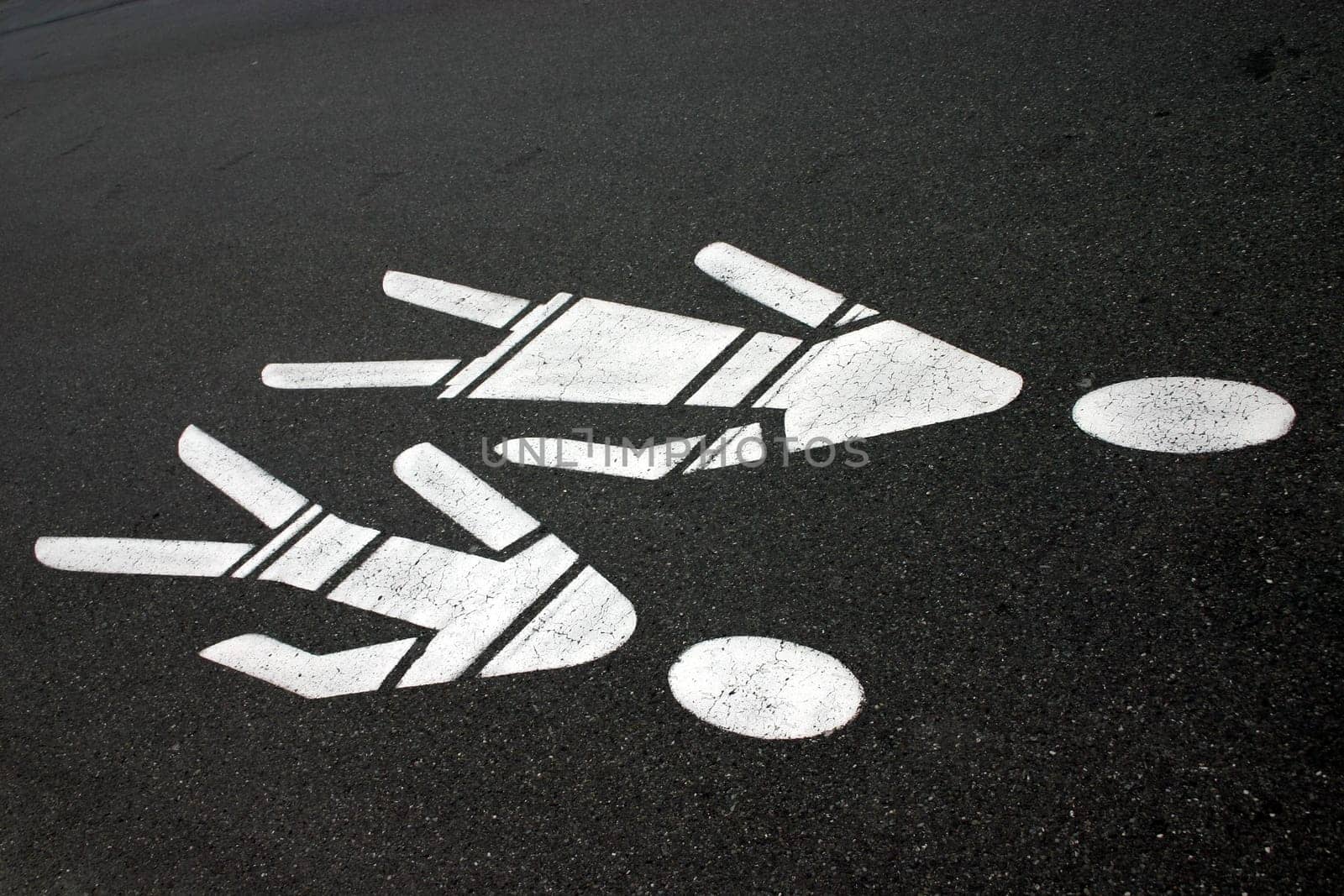 Mother-and-child signs on tar