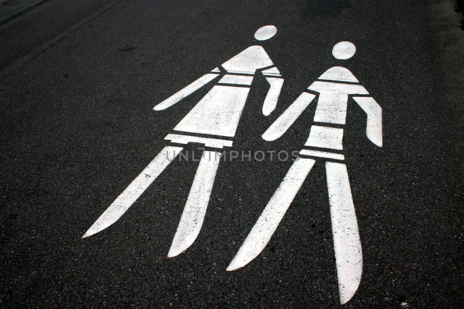 Man-and-woman symbol on tar