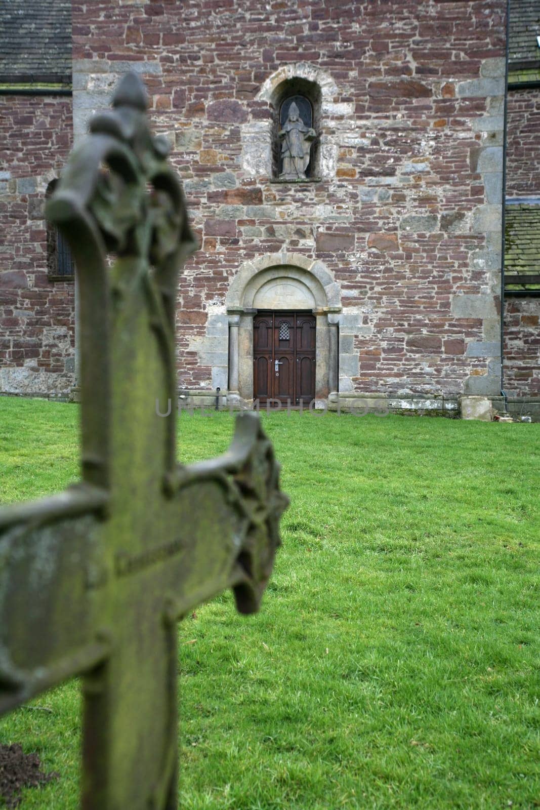Old grave cross in front of the portal of St. Kilian's Church in Lügde (Krreis Lippe,North Rhine-Westphalia)