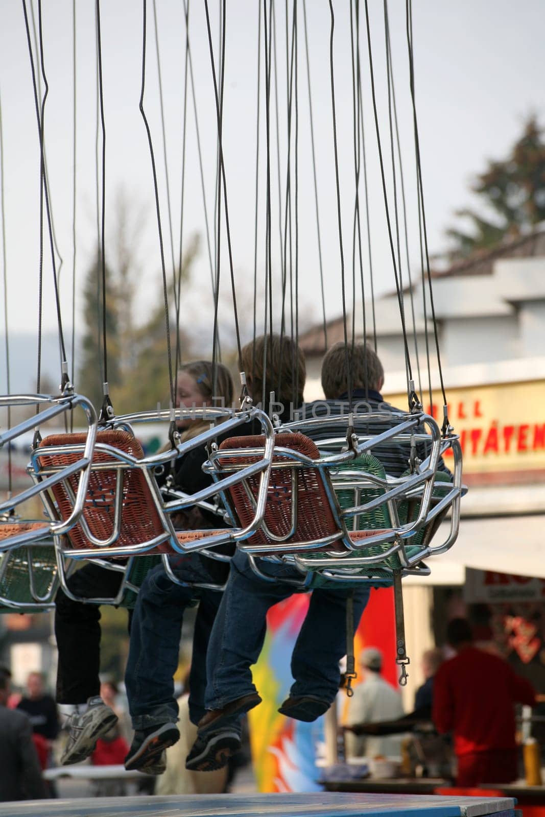 Passengers in a chain carousel before take-off