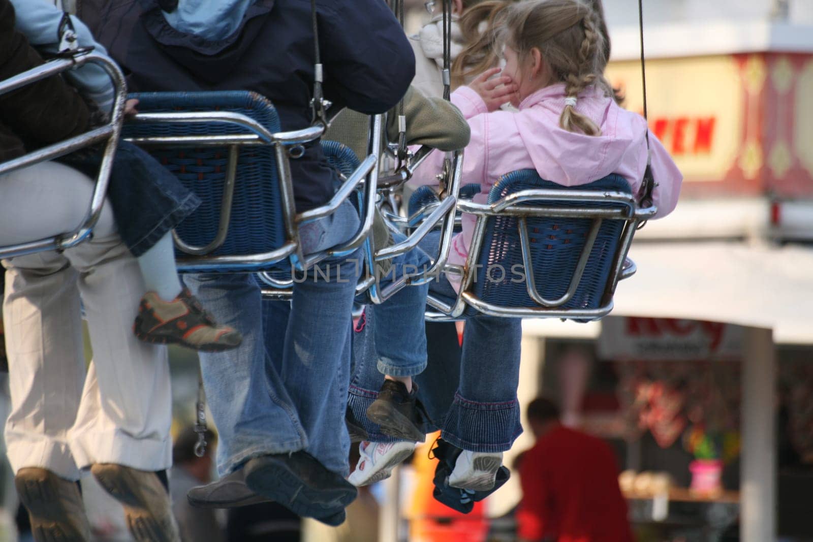 Passengers in a chain carousel before take-off