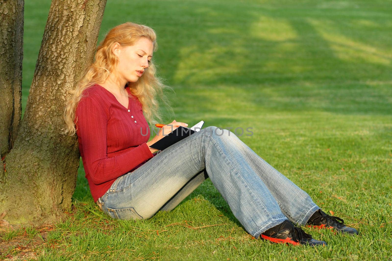 Young woman taking notes