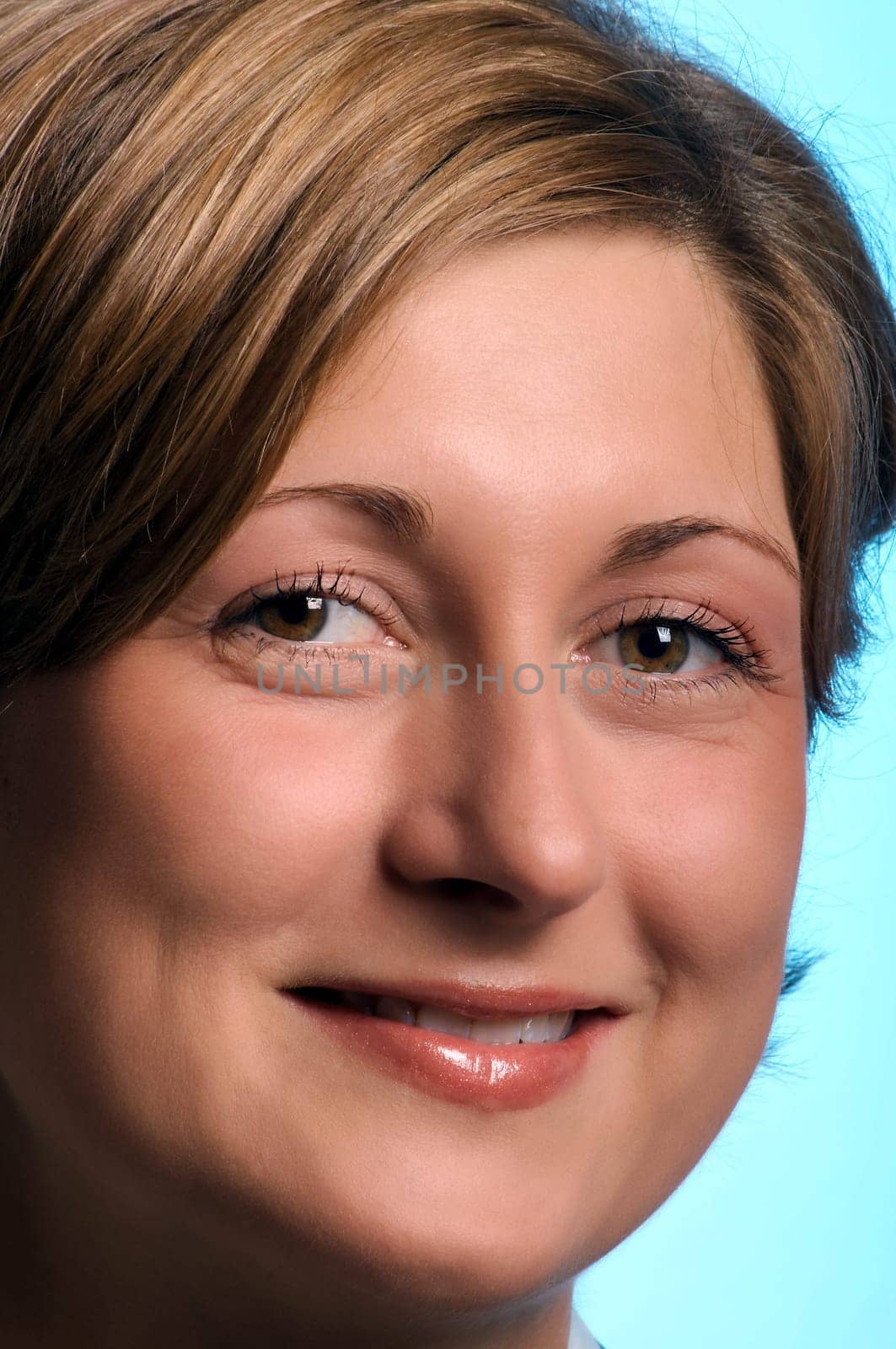 Portrait of a young woman against a blue background