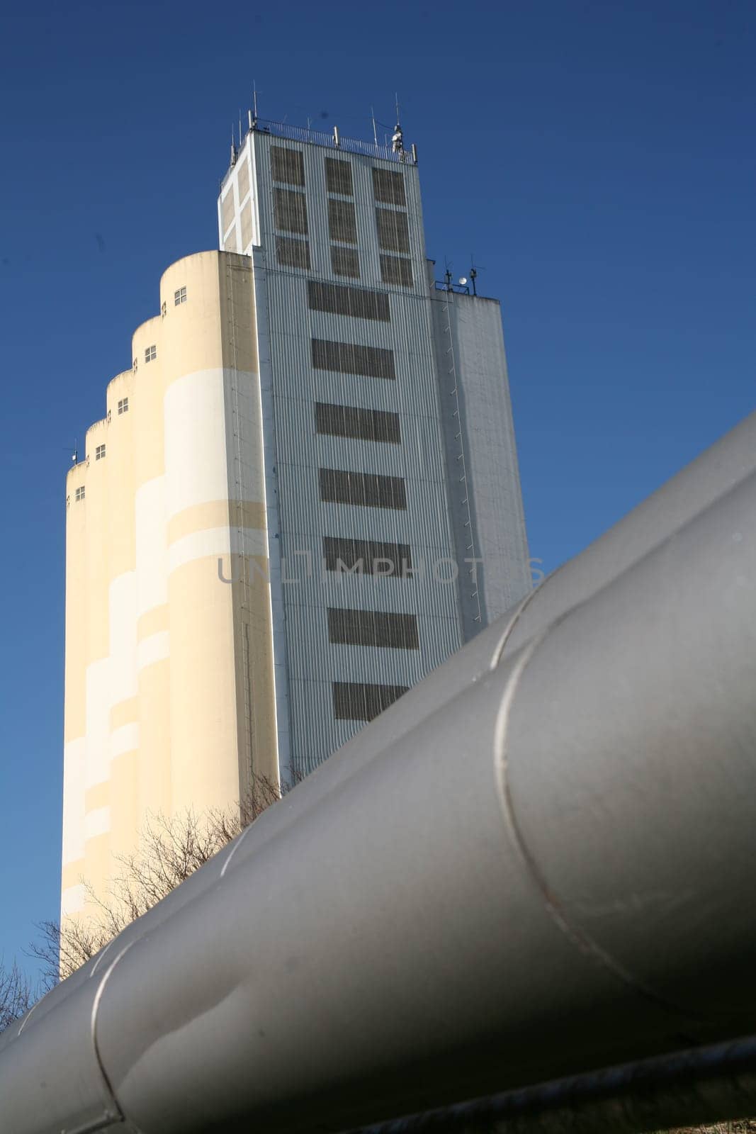 With grain silos of a mill