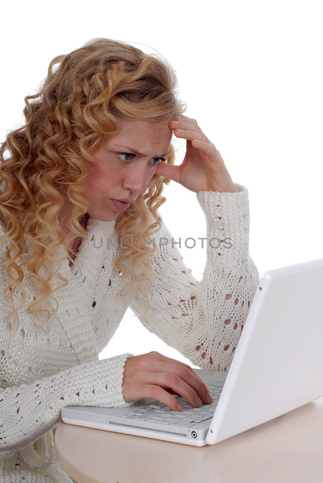 Young woman sitting at laptop