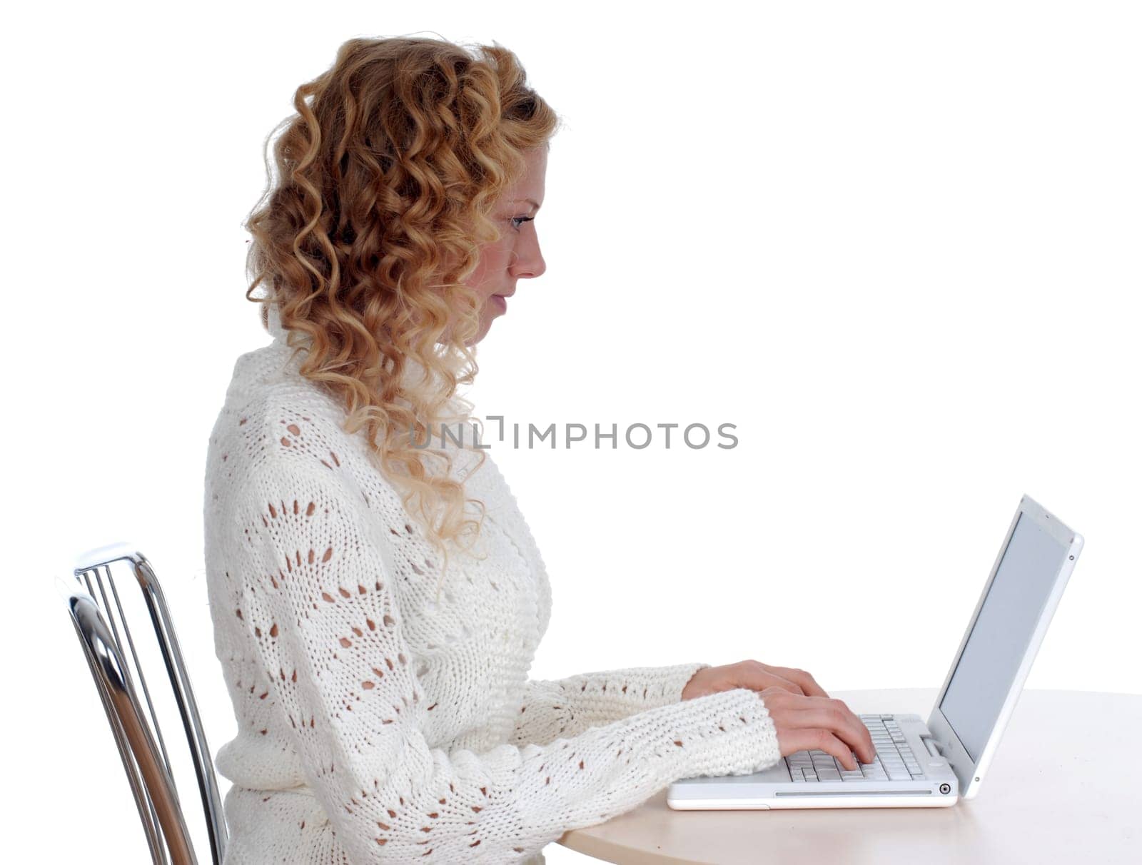 Young woman sitting at laptop