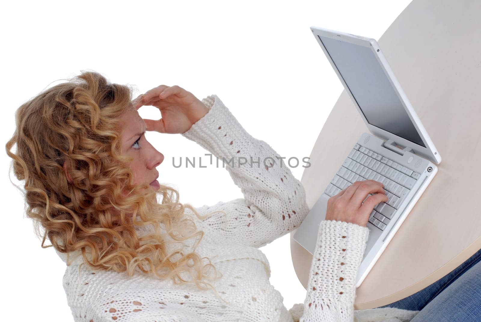 Young woman sitting at laptop