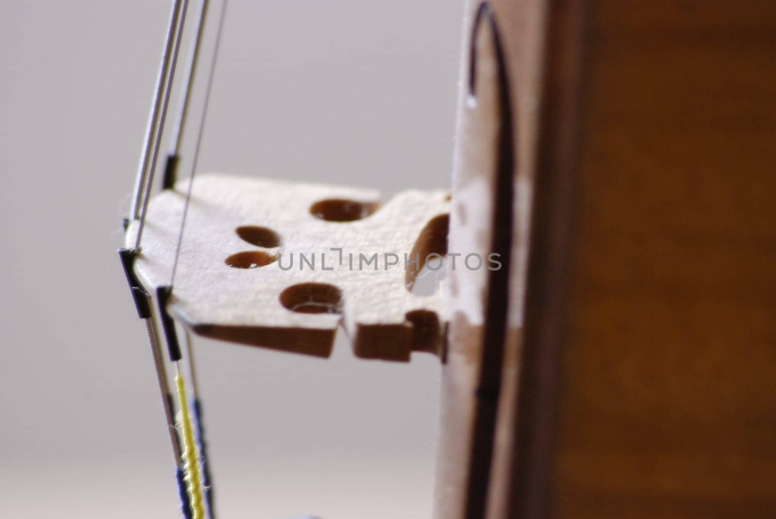 String guide over bridge