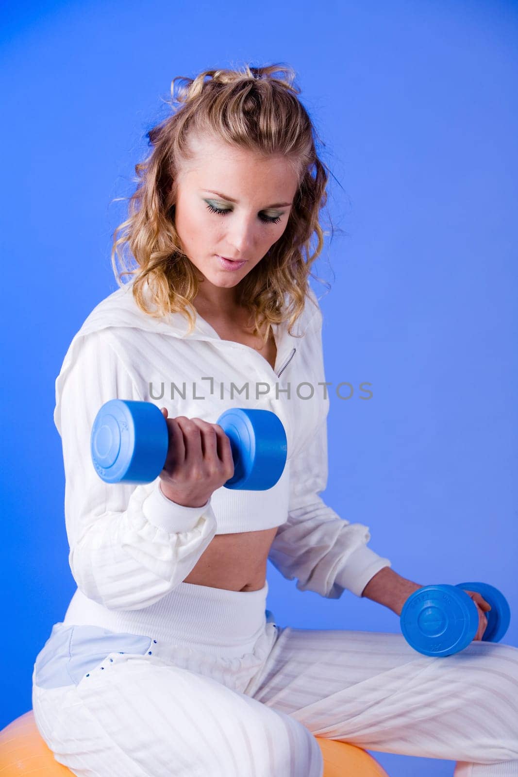Woman doing dumbbell training I